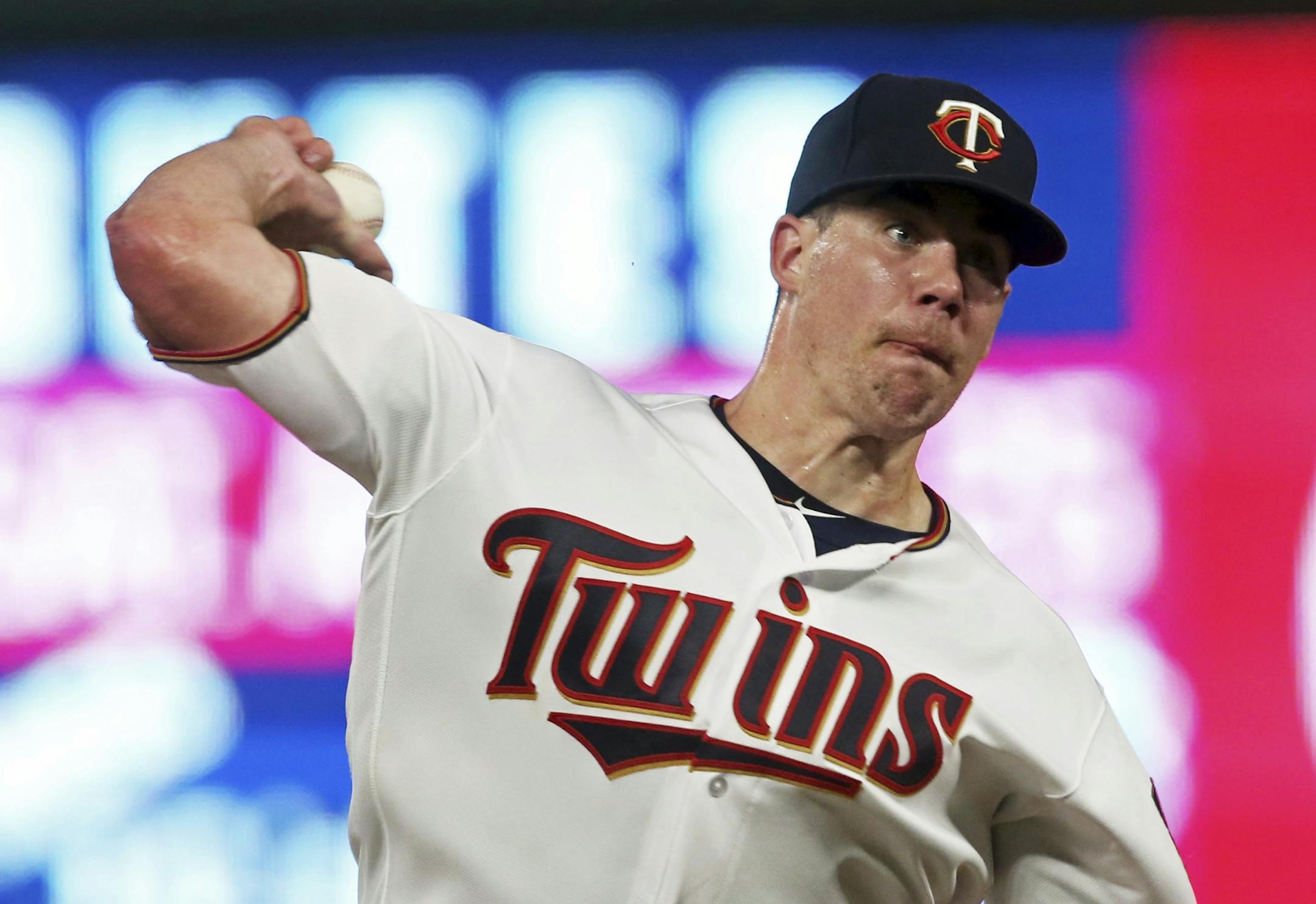 Minnesota Twins pitcher Trevor May throws to a Detroit Tigers batter during the fifth inning of a baseball game Thursday, Aug. 16, 2018, in Minneapolis. May gave up two bases-loaded walks.