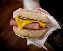 At Kim’s and the downstairs Bronto Bar, the “Ann’s ham” sandwich, a housemade version of Spam, is served with cheese, Kewpie mayo, mustard and