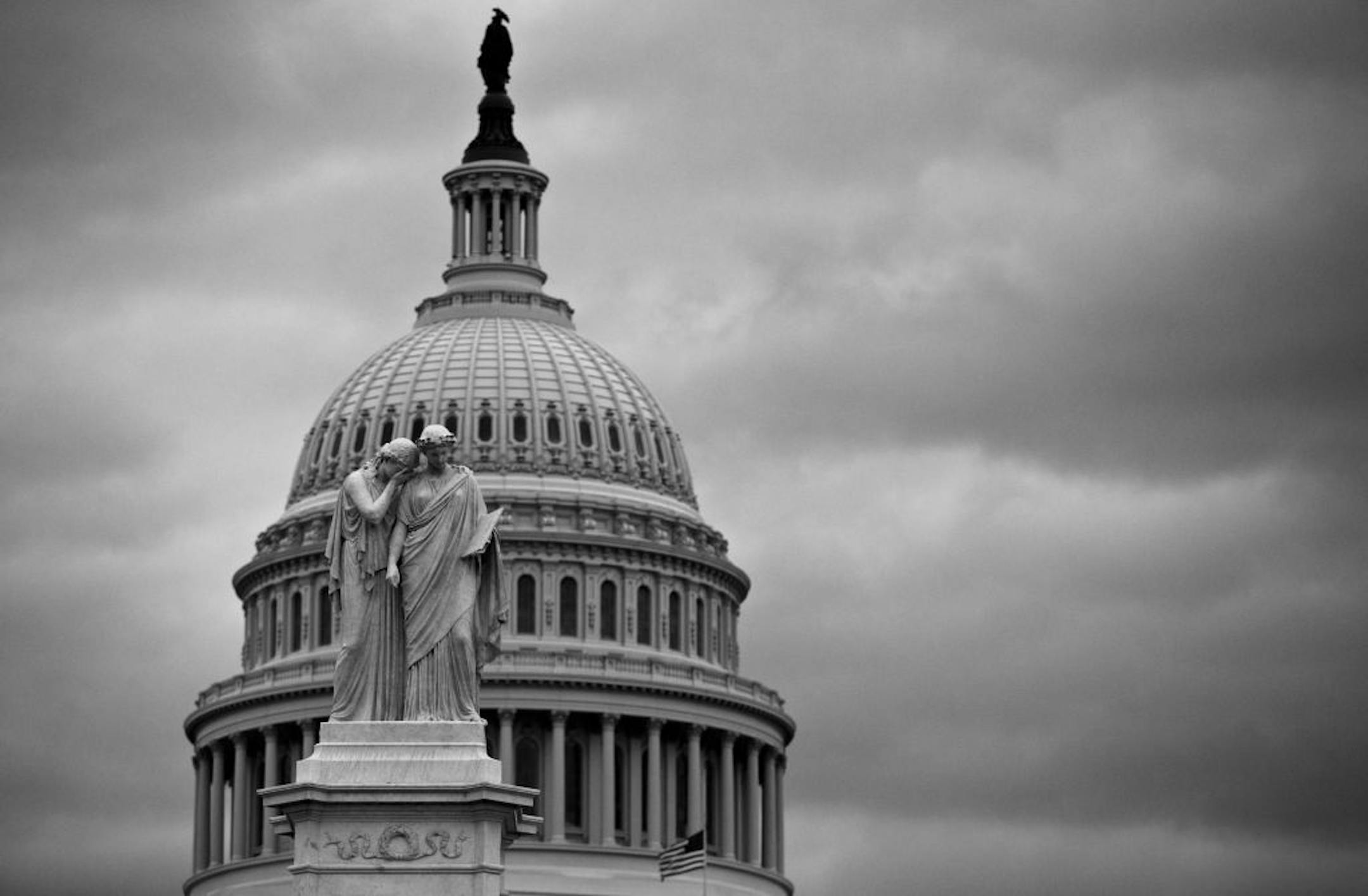 Gray skies covered the U.S. Capitol in Washington as Congress closes down for the holiday without a compromise on the "fiscal cliff" threatening the U.S. economy, in Washington, Friday, Dec. 21, 2012.