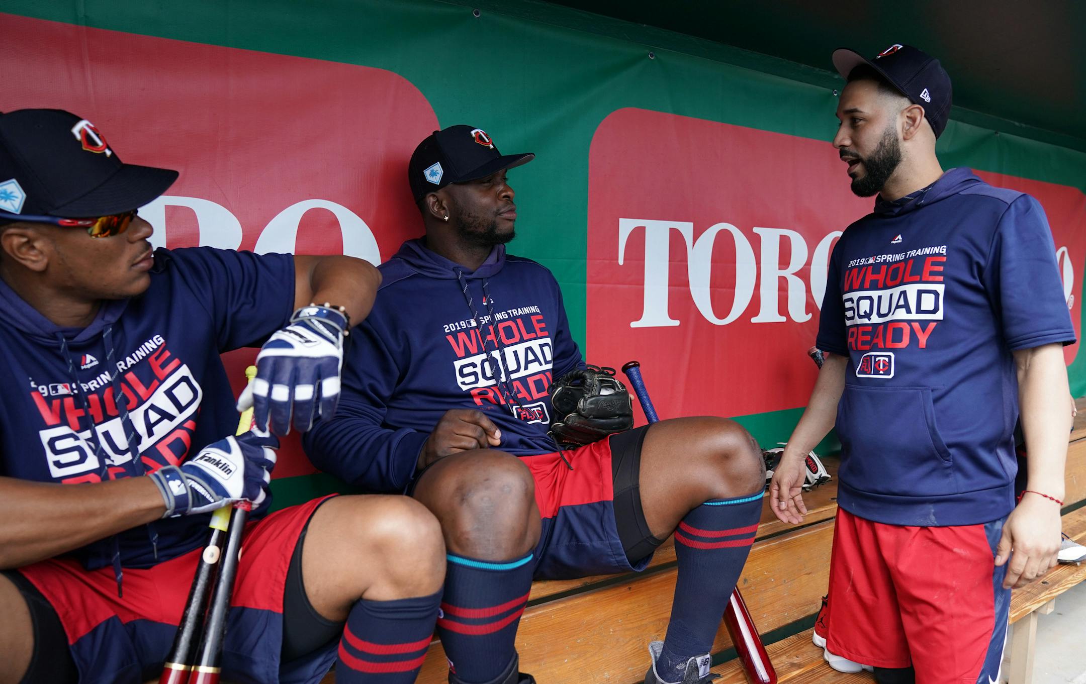Newly acquired Minnesota Twins utility player Marwin Gonzalez (9) talked with shortstop Jorge Polanco (11) and third baseman Miguel Sano (22) in the dugout before batting practice Monday morning. ] ANTHONY SOUFFLE • anthony.souffle@startribune.com The Minnesota Twins held a press conference to announce the signing of utility player Marwin Gonzalez (9) ahead of their game against the Baltimore Orioles Monday, Feb. 25, 2019 at the CenturyLink Sports Complex's Hammond Stadium in Fort Myers,