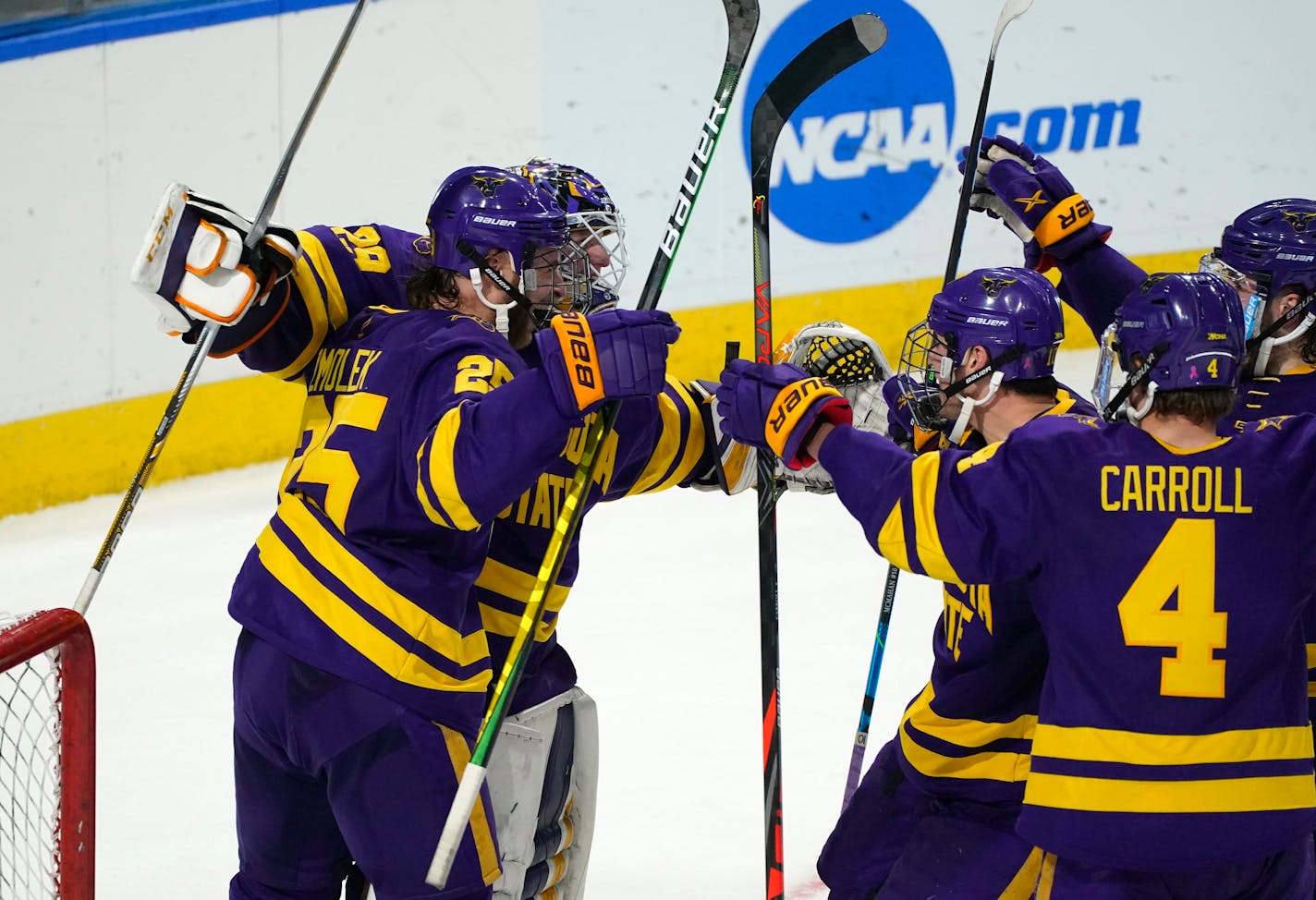 Minnesota State players surround goaltender Dryden McKay, back left, as time runs out in the third period of an NCAA College Hockey Regional Final against Minnesota, Sunday, March 28, 2021, in Loveland, Colo. (AP Photo/David Zalubowski)