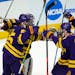 Minnesota State players surround goaltender Dryden McKay, back left, as time runs out in the third period of an NCAA College Hockey Regional Final aga