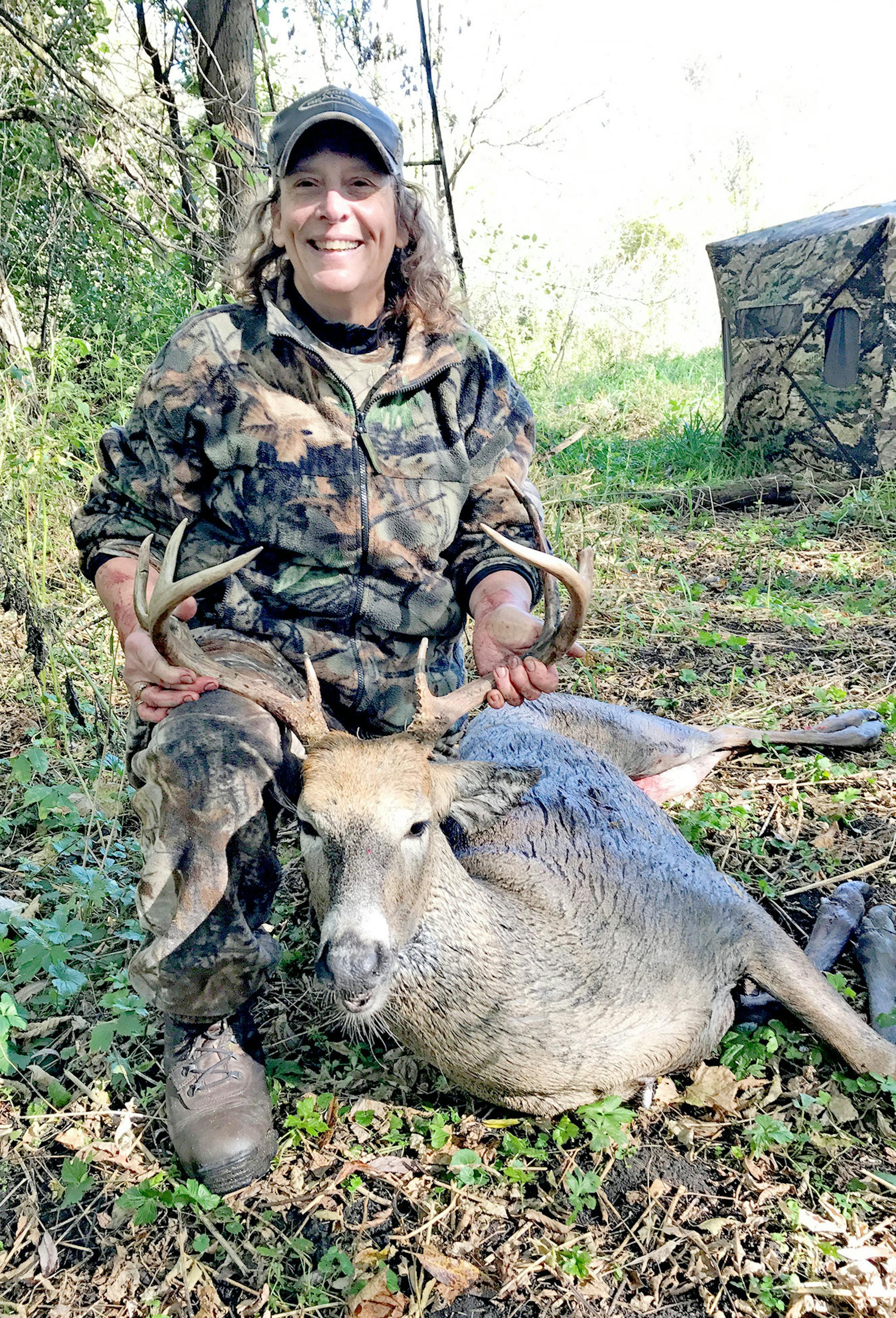Louise Miller of Farmington arrowed this 8-point buck in southern Dakota County on opening day of the firearms season. The shot happened at 8:30 a.m.