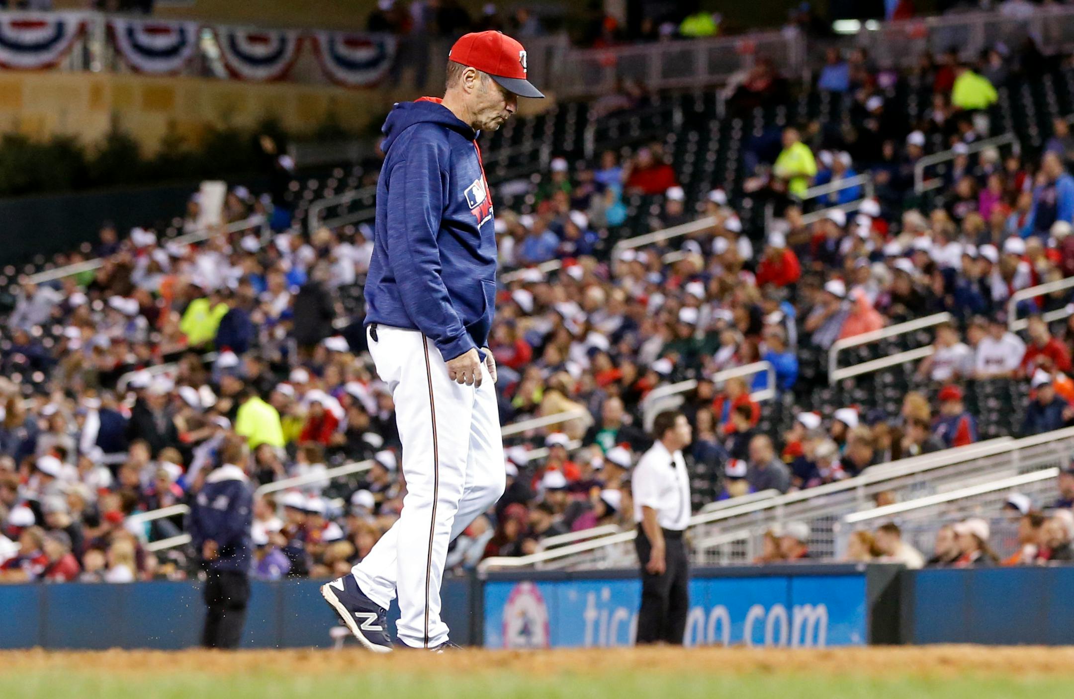 Minnesota Twins manager Paul Molitor walks back to the dugout after one of three pitching changes during the seventh inning of a baseball game against the Seattle Mariners Friday, Sept. 23, 2016, in Minneapolis. The Mariners won 10-1. (AP Photo/Jim Mone)
