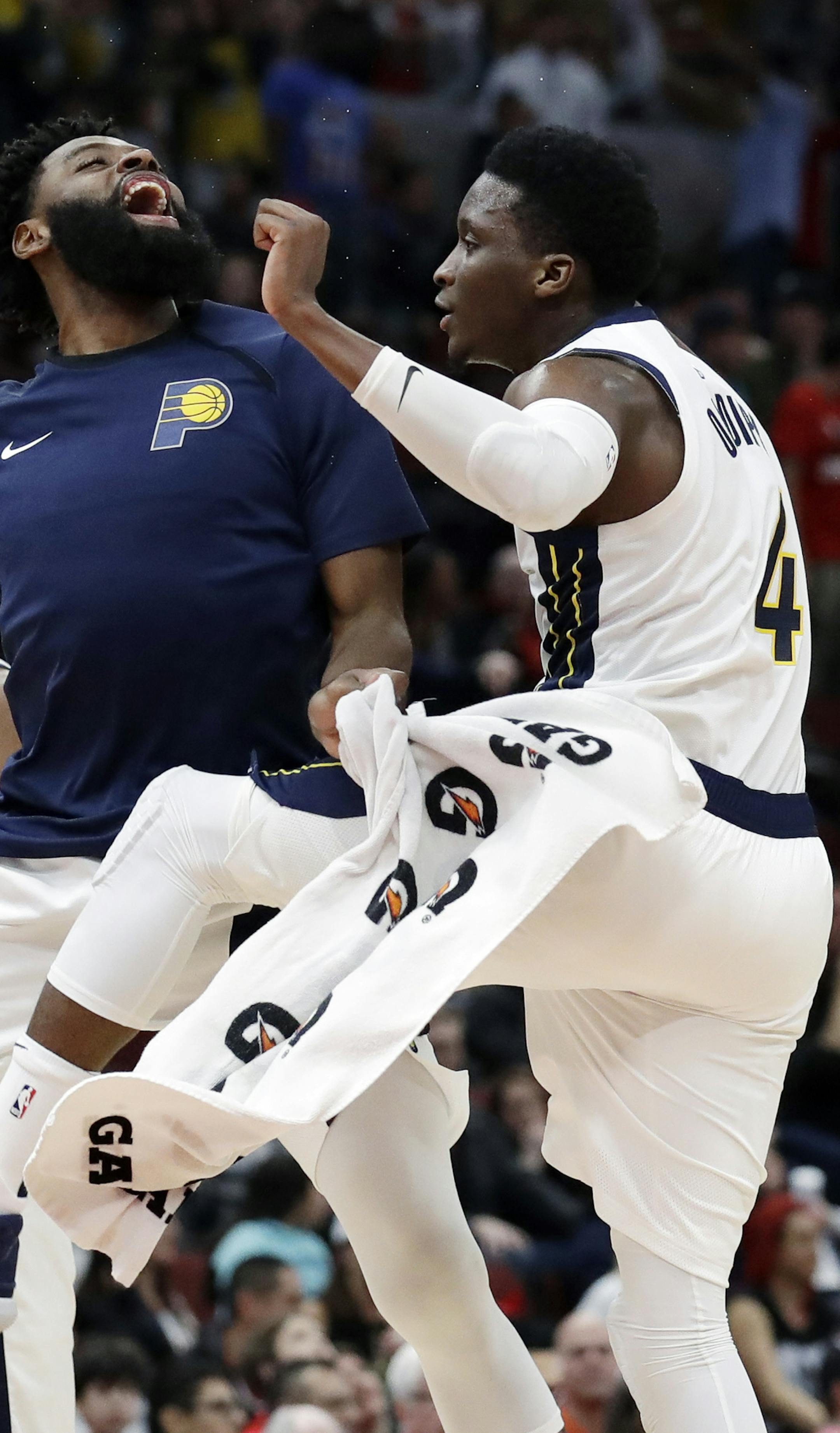 Indiana Pacers guard Victor Oladipo, right, celebrates with guard Tyreke Evans after he made a three-point basket against the Chicago Bulls during overtime of an NBA basketball game Friday, Jan. 4, 2019, in Chicago. (AP Photo/Nam Y. Huh)
