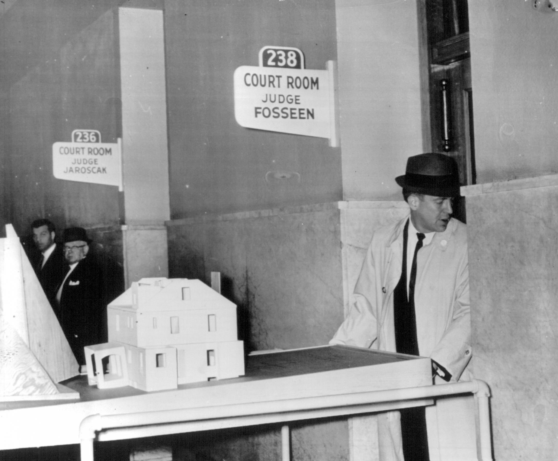 November 13, 1963 Asst. County Atty. Al Ranum Took Model of house Into court - The white painted plywood model was shown to the jury. November 12, 1963 Associated Press