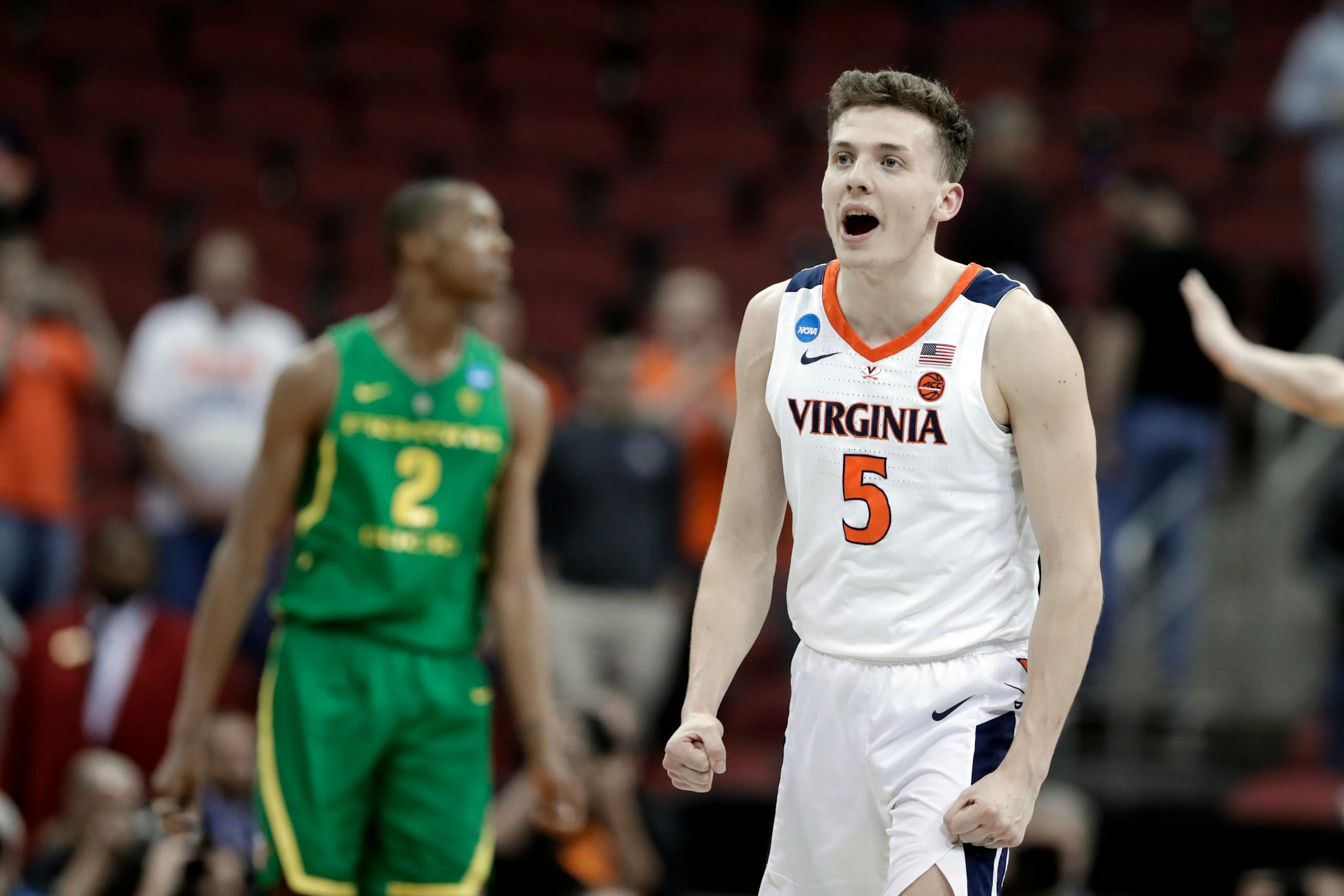 Virginia's Kyle Guy celebrates following a men's NCAA Tournament college basketball South Regional semifinal game against Oregon, Friday, March 29, 2019, in Louisville, Ky. Virginia won 53-49. (AP Photo/Michael Conroy)