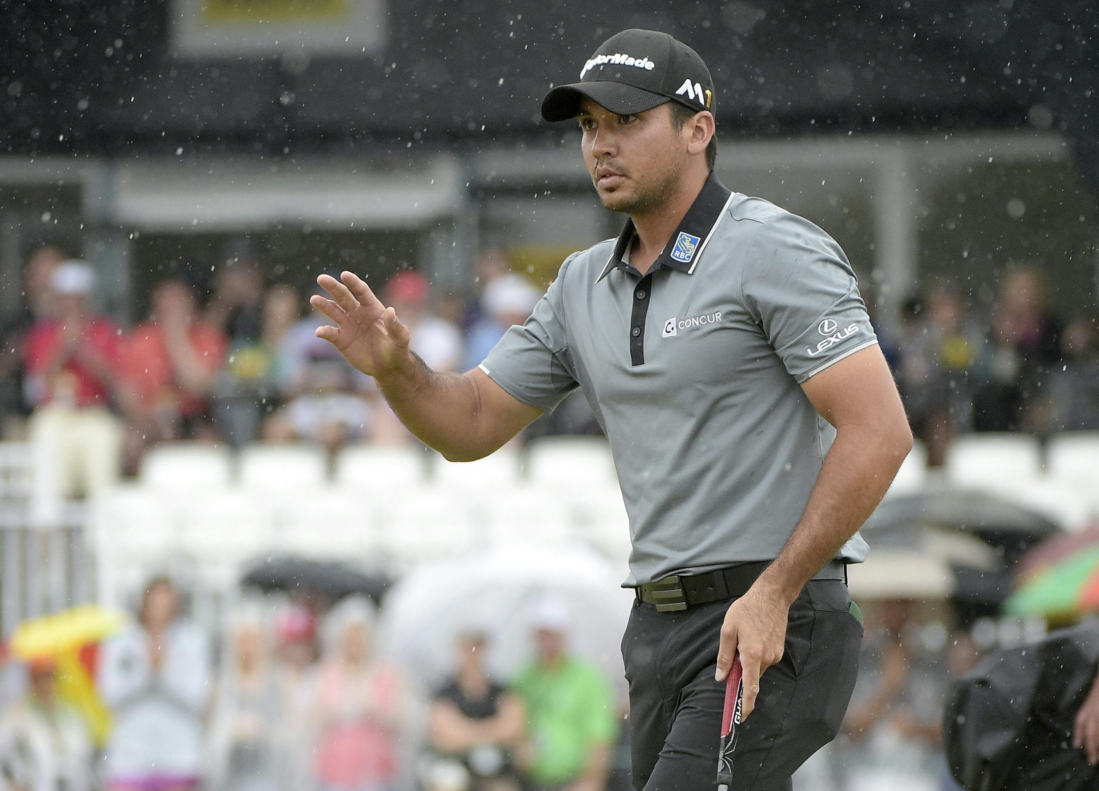 Jason Day, of Australia, acknowledges the crowd after making his putt on the ninth green during the third round of the Arnold Palmer Invitational golf tournament in Orlando, Fla., Saturday, March 19, 2016. (AP Photo/Phelan M. Ebenhack)