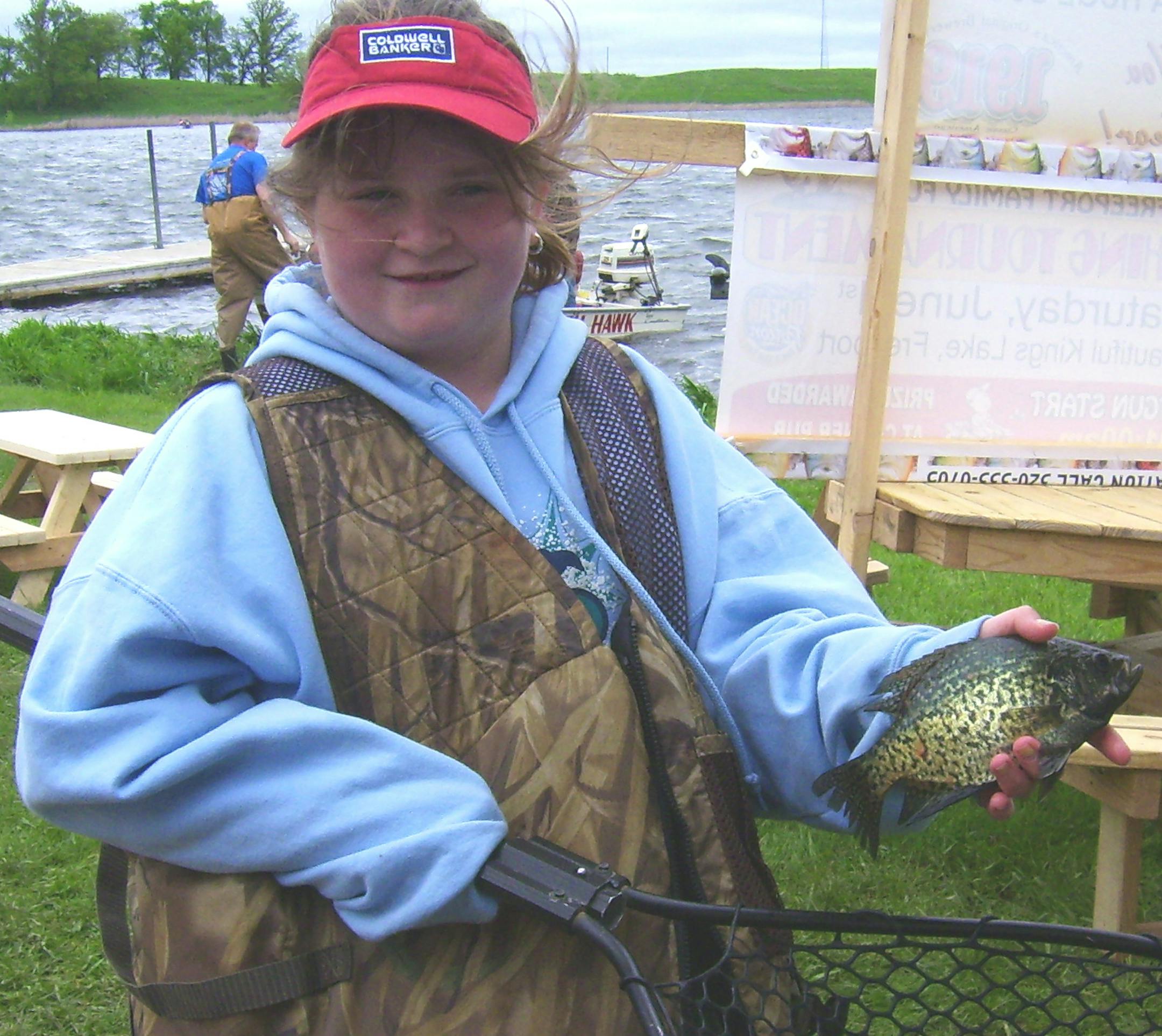Gracelynn Powell of St. Cloud with a crappie caught in a kid's fishing contest on Saturday.