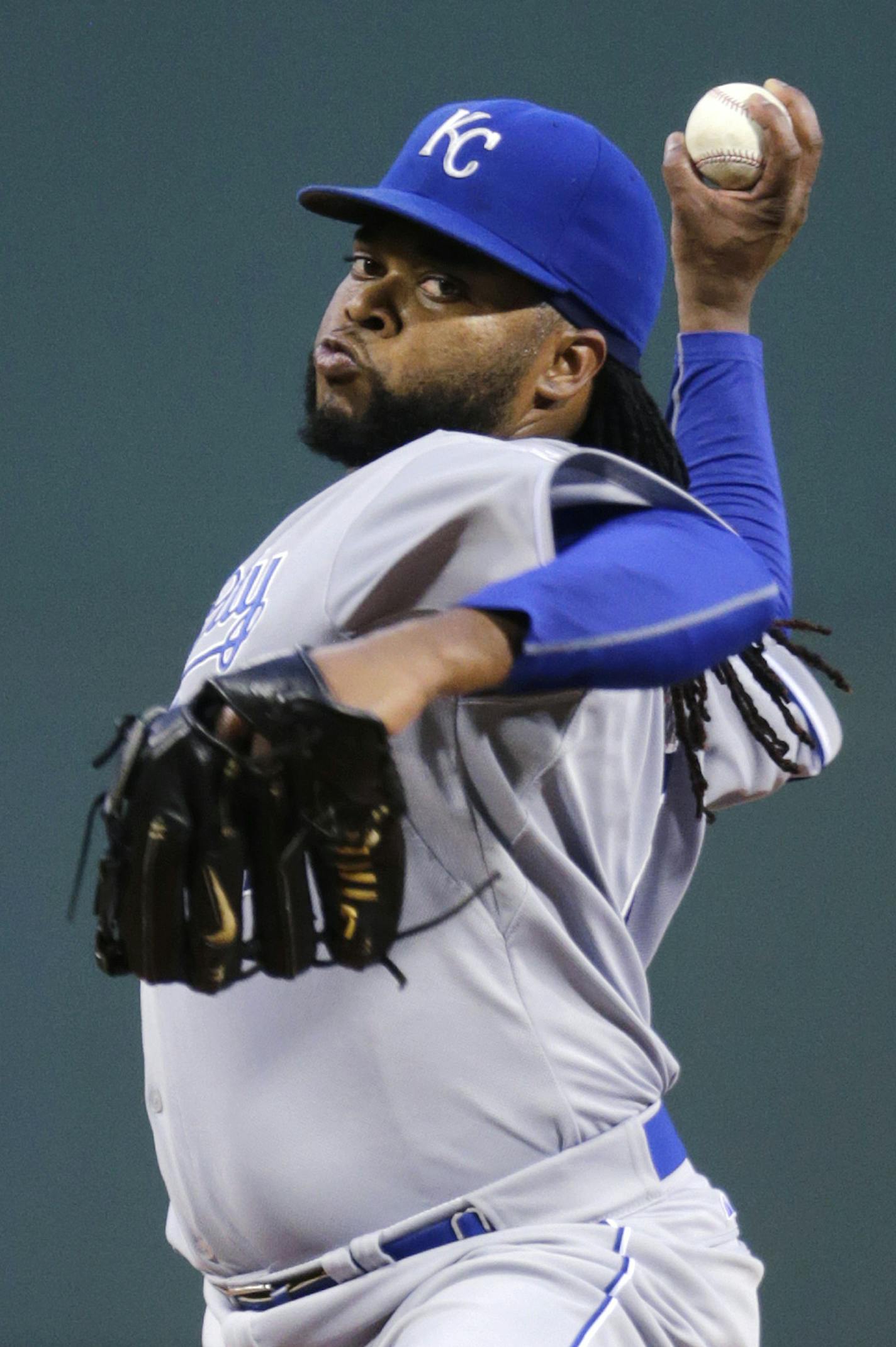 Kansas City Royals starting pitcher Johnny Cueto delivers during the first inning of a baseball game against the Boston Red Sox at Fenway Park in Boston, Friday, Aug. 21, 2015. (AP Photo/Charles Krupa) ORG XMIT: MIN2015090418250758