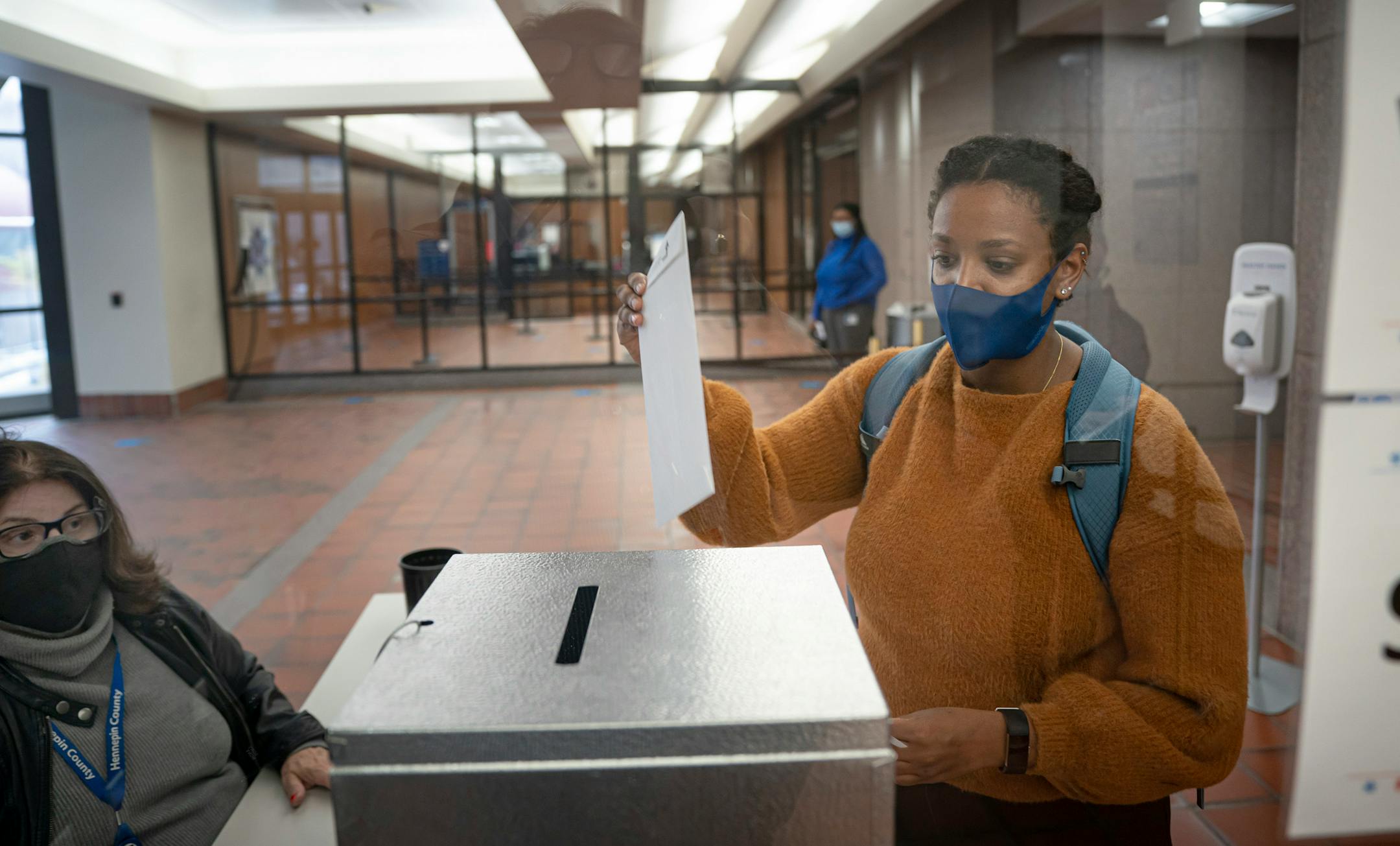 Sisay Shannon-Tamrat dropped her ballot in the ballot box Wednesday at the Hennepin County Government Center. ] GLEN STUBBE • glen.stubbe@startribune.com Wednesday, October 21, 2020