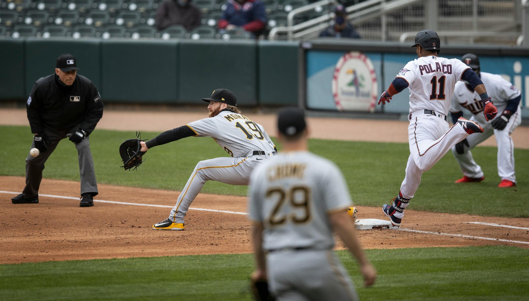 Minnesota Twins shortstop Jorge Polanco (11) was safe at first in he second inning as Pittsburgh Pirates first baseman Colin Moran (19) waited for the ball.