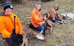 (From left) Gavin Lagro, 12; Kale Flemming, 11; and Henry Lagro, 11, shot antlerless deer within an hour of each other in northern Wisconsin.