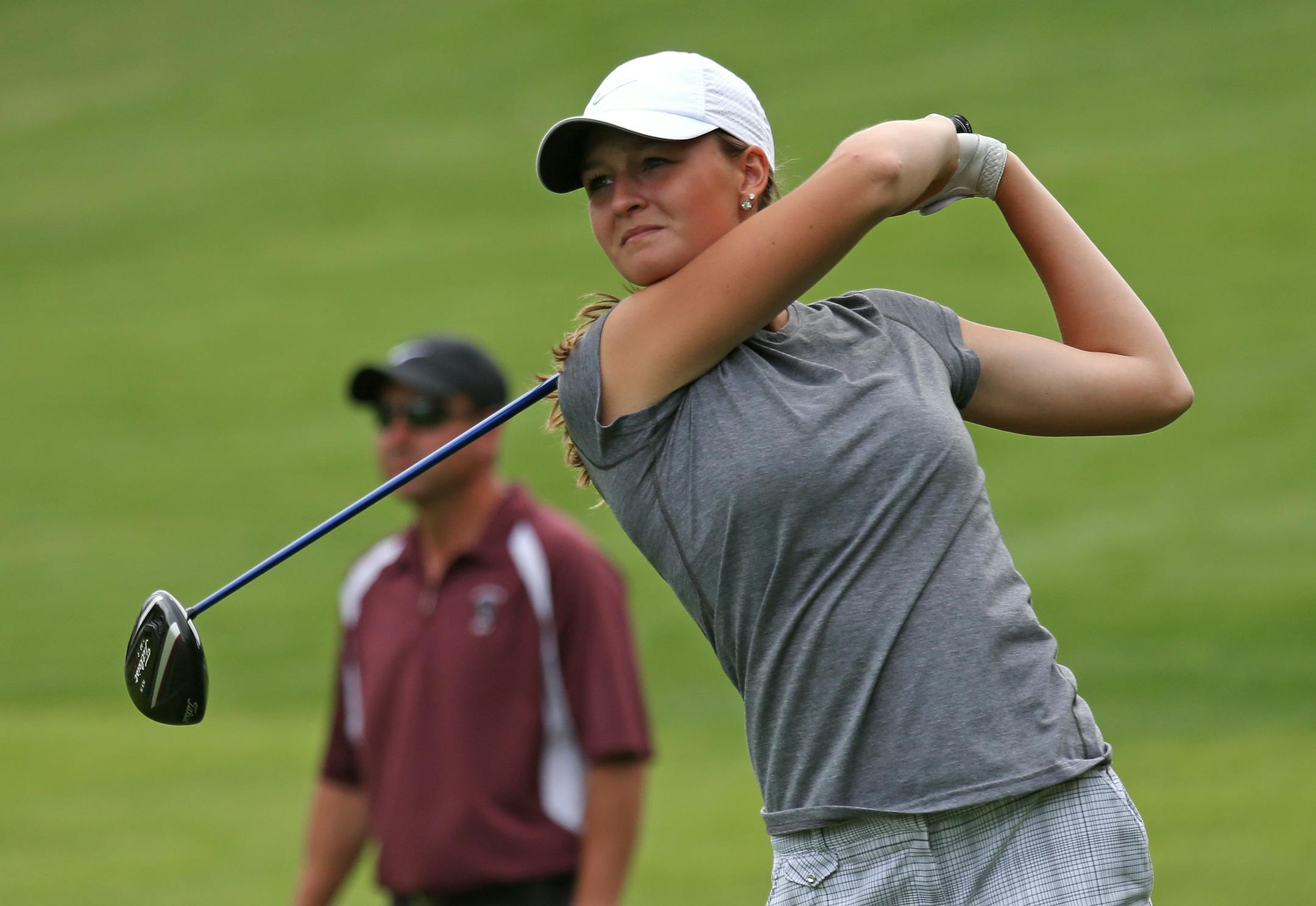 Kenzie Neisen (shown golfing for New Prague in 2014), who was a two-time state high school individual golf champion, captured her second consecutive Big 12 Conference individual title over the weekend in San Antonio.