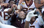 Gophers coach PJ Fleck celebrated with his players during a team photo following their Outback Bowl victory against Auburn.