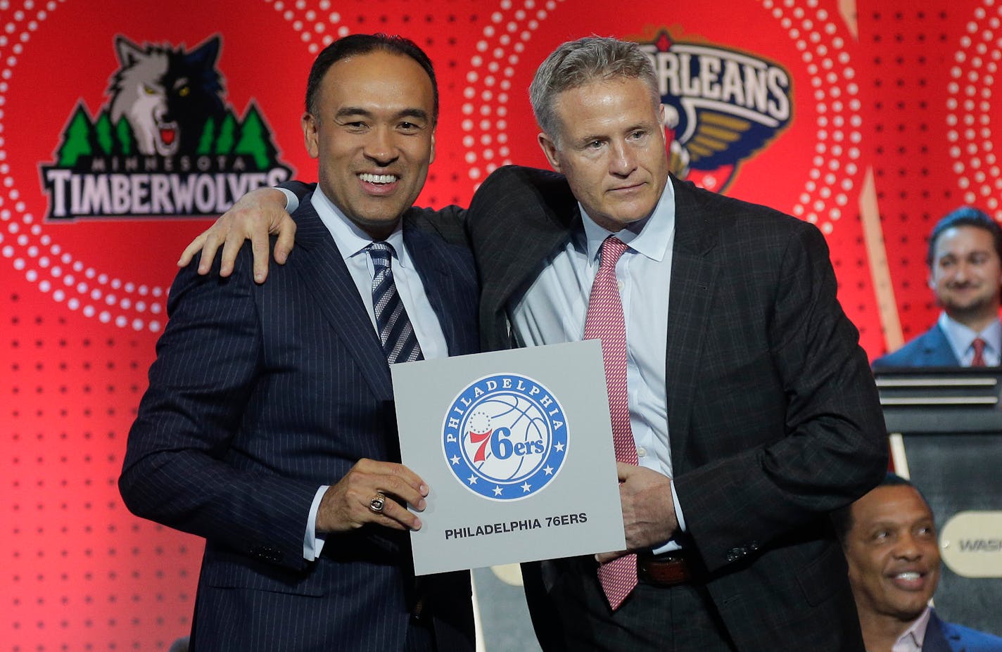 NBA deputy commissioner Mark Tatum, left, poses for a photo with Philadelphia 76ers head coach Brett Brown during the NBA basketball draft lottery, Tuesday, May 17, 2016, in New York. The 76ers won the top pick in this year's draft. (AP Photo/Julie Jacobson)