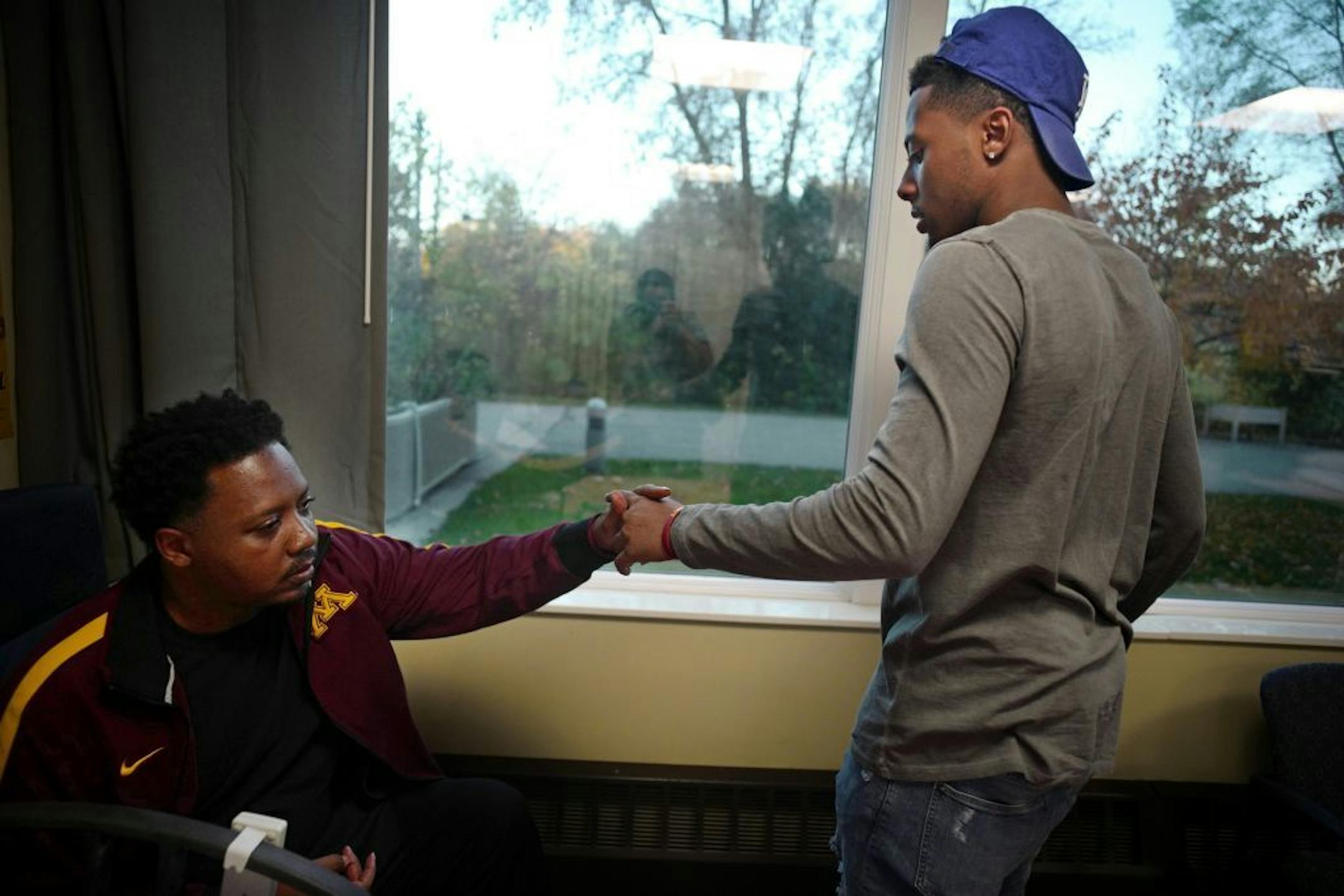 Curtis Johnson enjoyed the visit from his son, Jarvis at the Courage Kenny Rehabilitation Institute. Curtis has since moved into a more independent facility.