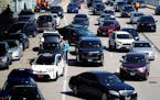 FILE - Heavy traffic is seen at O'Hare International Airport in Chicago, Monday, April 15, 2024. Relentlessly rising auto insurance rates are squeezin