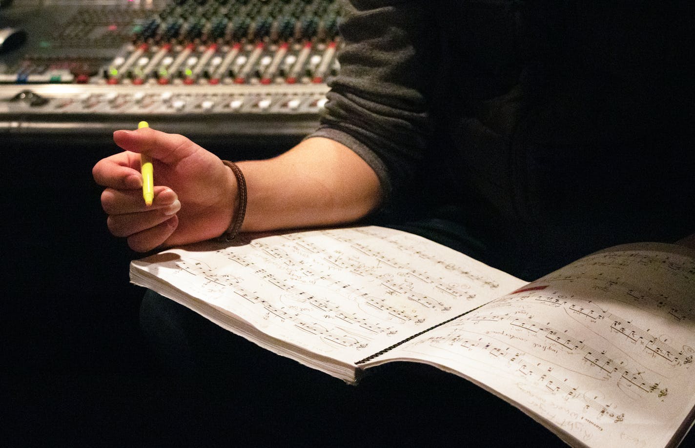 MN Varsity Featured Artist Jax Wittenberg listens back to his guitar perfomance while annotating his sheet music in between recording sessions in the control room of a recording studio at Classical MPR&#x2019;s headquarters in St. Paul on Saturday, Feb. 29, 2020. ] ANDY KOSIER&#x2022; andy.kosier@startribune.com