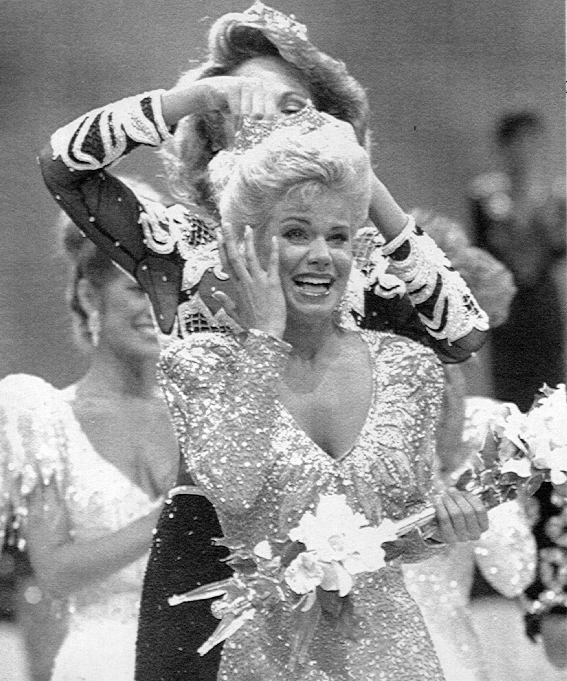 September 11, 1988 Early Start -- Miss America 1989, Gretchen Carlson of Anoka, Minn. trys her crown as she poses for photographers early Sunday morningon the beach at Atlantic City, N.J. Carlson won the title late Saturday night at Atlantic City. Jack Kanthal, Minneapolis Star Tribune; AP Laserphoto