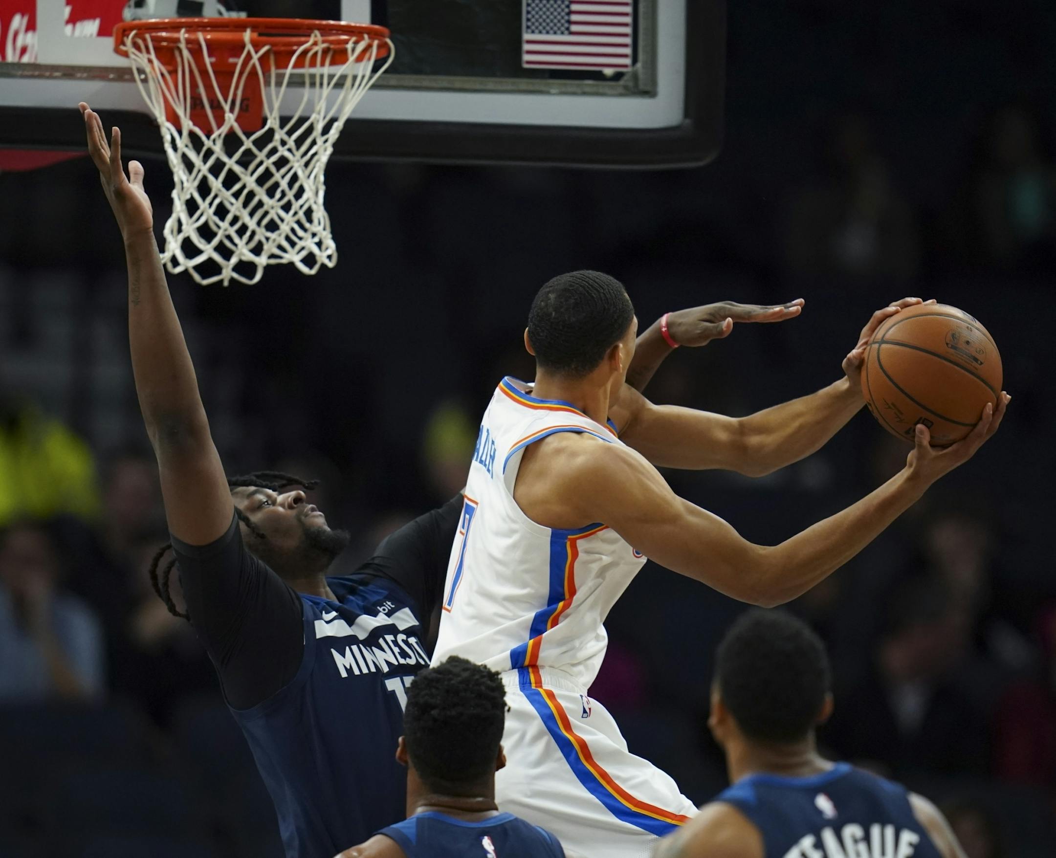 Minnesota Timberwolves center Naz Reid (11) defended Oklahoma City Thunder forward Darius Bazley (7) as he shot in the first half.