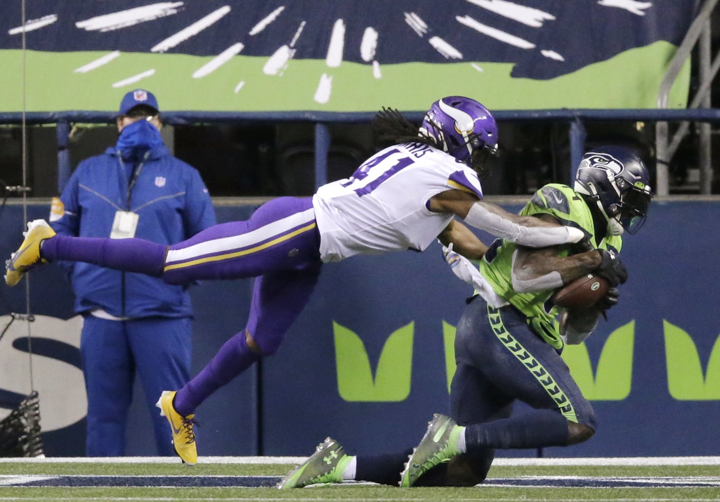 Seattle Seahawks' DK Metcalf, right, catches the ball in the end zone for a touchdown as Minnesota Vikings' Anthony Harris defends near the end of the second half of an NFL football game, Sunday, Oct. 11, 2020, in Seattle. (AP Photo/John Froschauer)