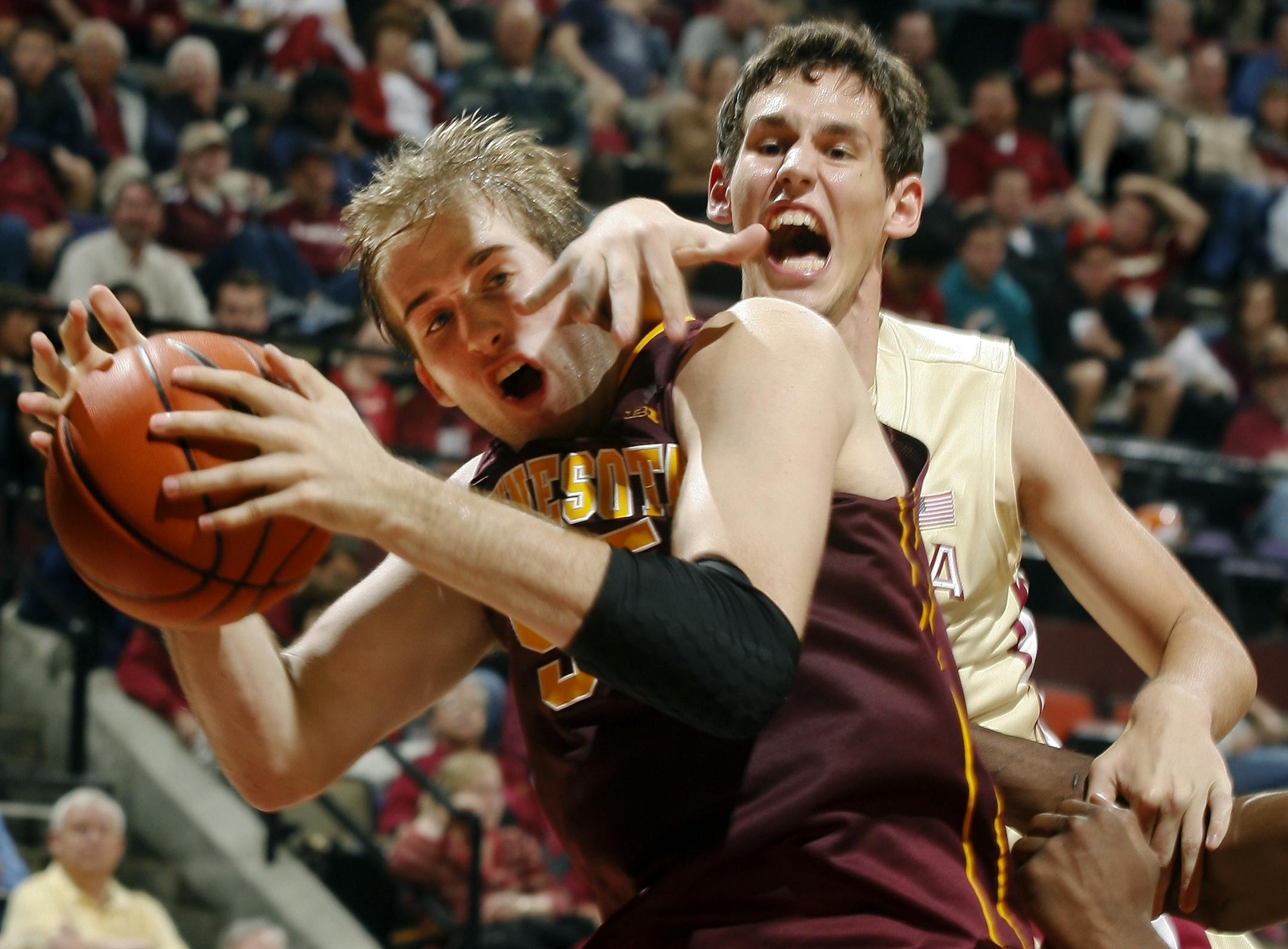 Minnesota center Elliott Eliason (55) is fouled by Florida State center Boris Bojanovsky (15) Tuesday night.