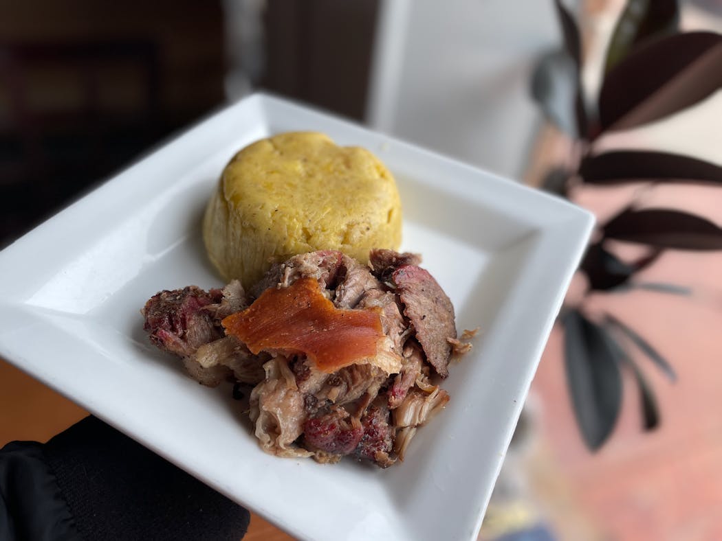 A taste of the island at El Jibarito: crispy skin and tender roast pork alongside the garlicky comforts of mofongo.