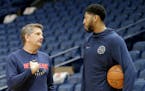 New Orleans Pelicans forward Anthony Davis (23) talks with assistant coach Chris Finch during practice at the Smoothie King Center in New Orleans on T