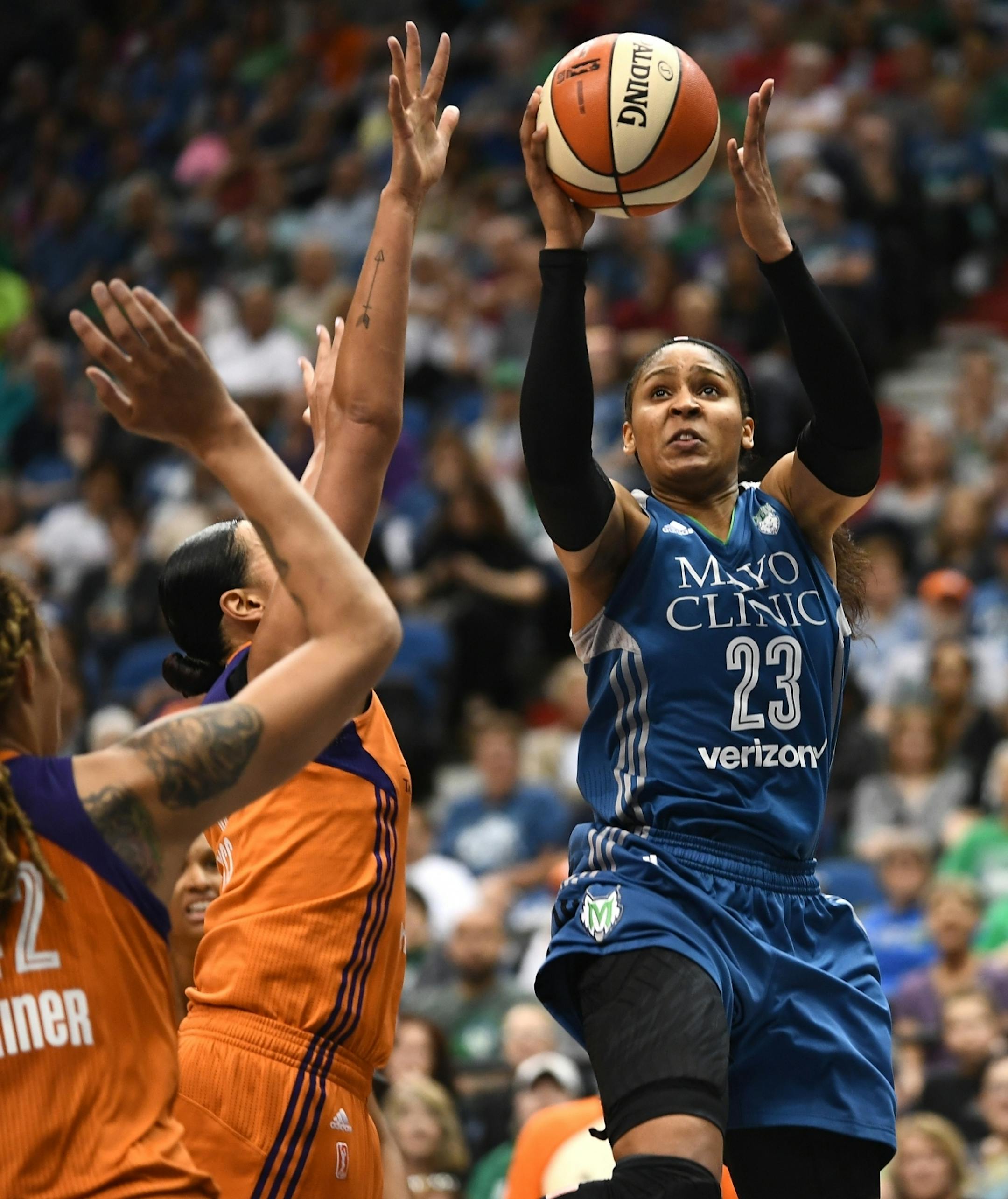 Minnesota Lynx forward Maya Moore (23) attempted a 2-point shot over Phoenix Mercury defenders in the second quarter Tuesday.