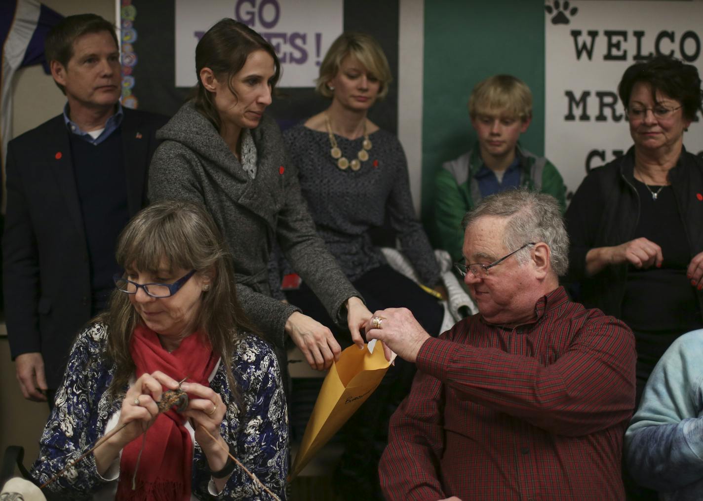 Janeen Raaen collected a ballot from Dan Lowry during the Burnsville precinct 9 Republican caucus Tuesday night. Knitting at left was Nancy Bekedam. ] JEFF WHEELER &#xef; jeff.wheeler@startribune.com Eagan and Burnsville residents gathered to attend their precinct caucuses at Black Hawk Middle School Tuesday evening, March 1, 2016.