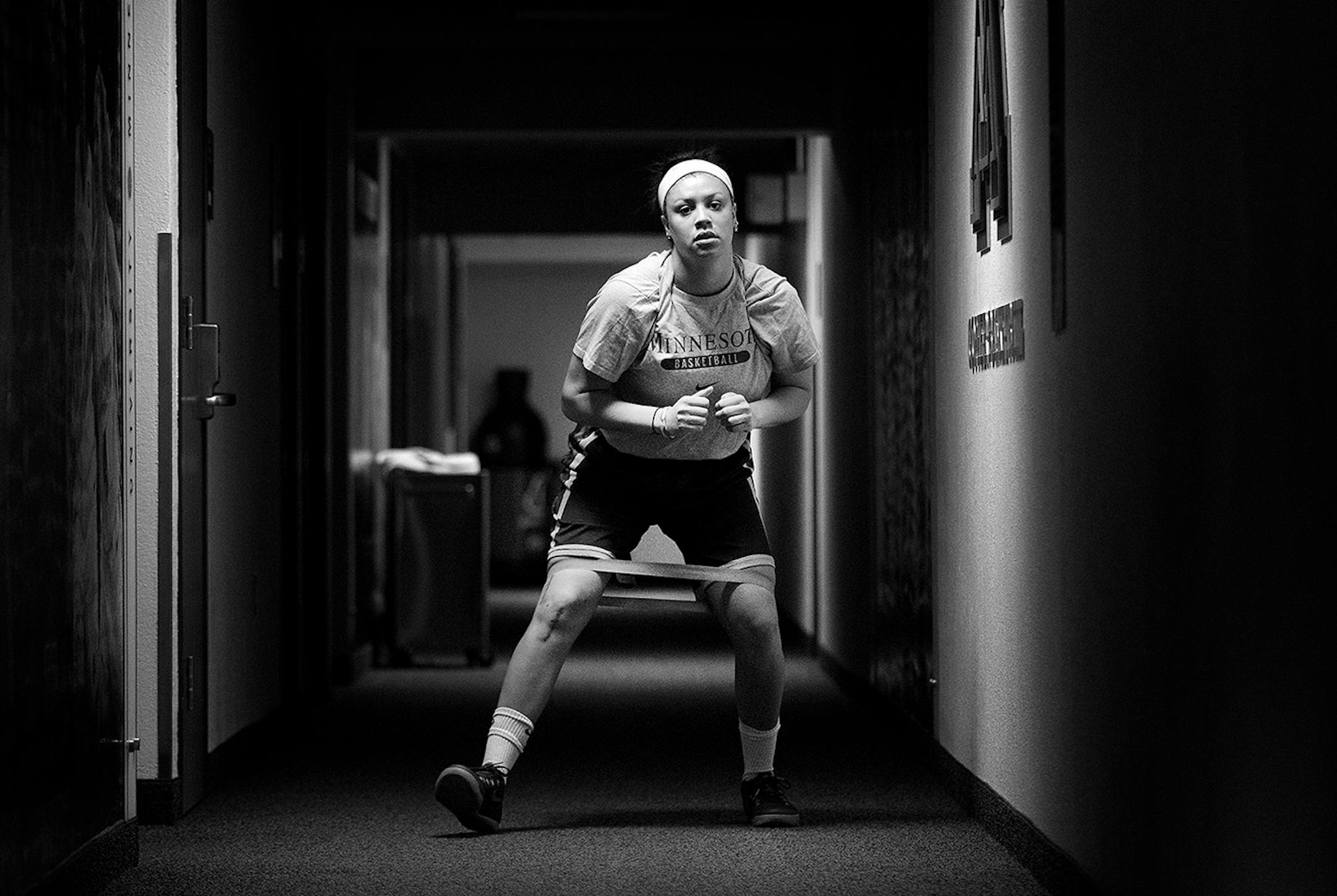 Rachel Banham worked out her legs during a rehabilitation session in a lower level hallway inside of Williams Arena on May 13, 2015.