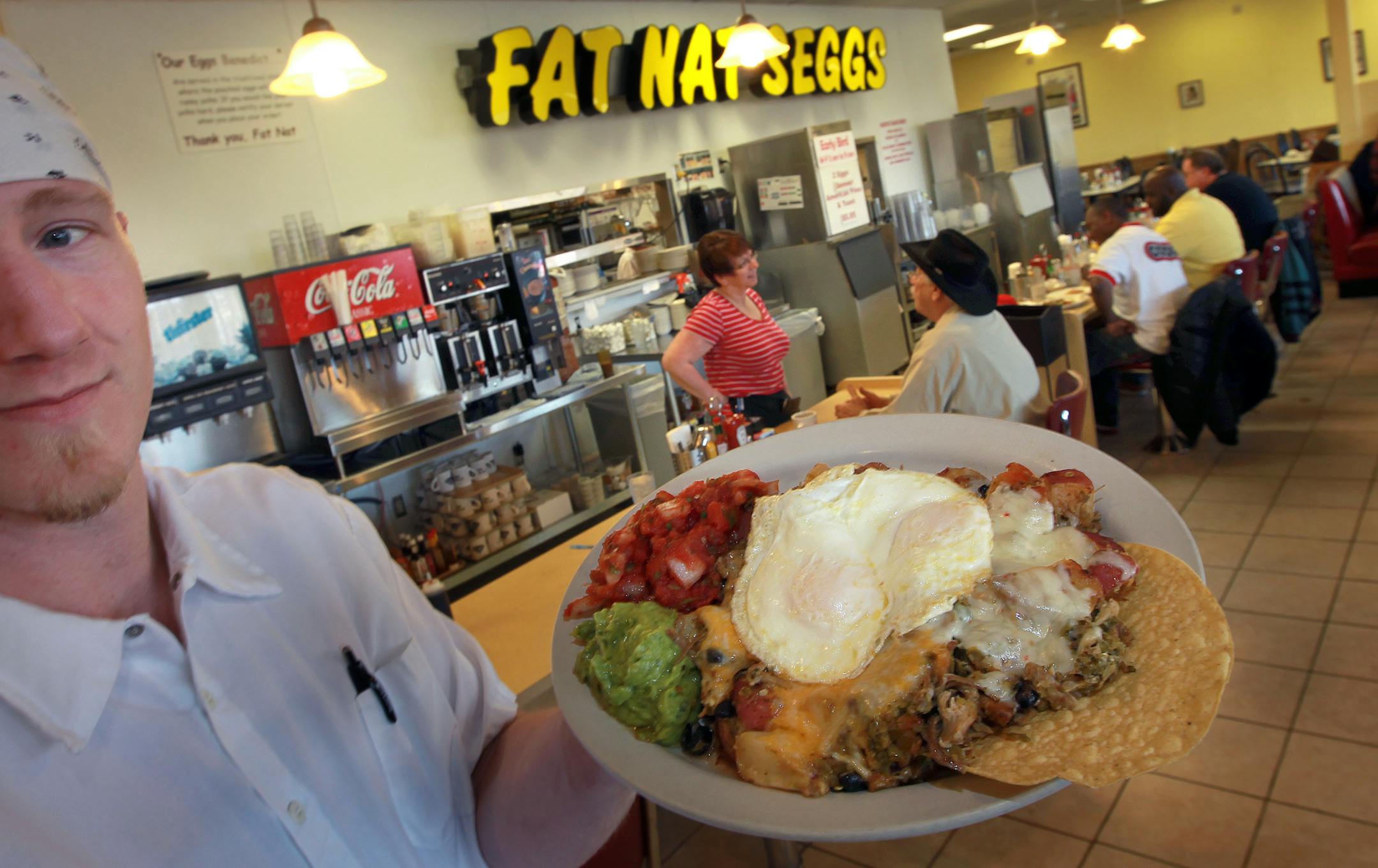 Bubba Shows off the Heuvos rancheros at Nat's Fat Eggs, 3540 Winnetka Av N, New Hope. Restaurant review: Don't say that there's nowhere interesting to eat in the northwest suburbs. A dozen must-visit dining destinations, from bars to bakeries to Peruvian cafes are in the fabric of the northwest communities. ] TOM WALLACE&#x2022; TWALLACE@startribune.com _ Assignments #20028655A_ April 25, 2013_ SLUG: 123813 rn050213 EXTRA INFORMATION: 1. Nat's Fat Eggs, 3540 Winnetka Av N, New Hope, 763 540-0234