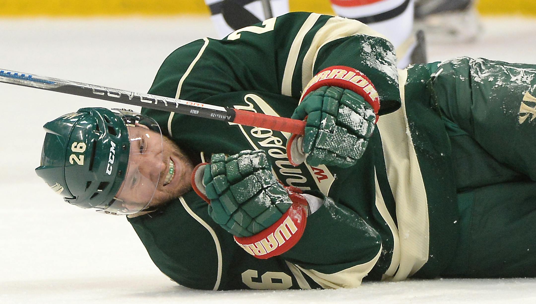 Minnesota Wild left wing Thomas Vanek (26) winced in pain on the ice after falling in the first period. ] (AARON LAVINSKY/STAR TRIBUNE) aaron.lavinsky@startribune.com The Minnesota Wild played the Chicago Blackhawks on Tuesday, March 29, 2016 at Xcel Energy Center in St. Paul, Minn.