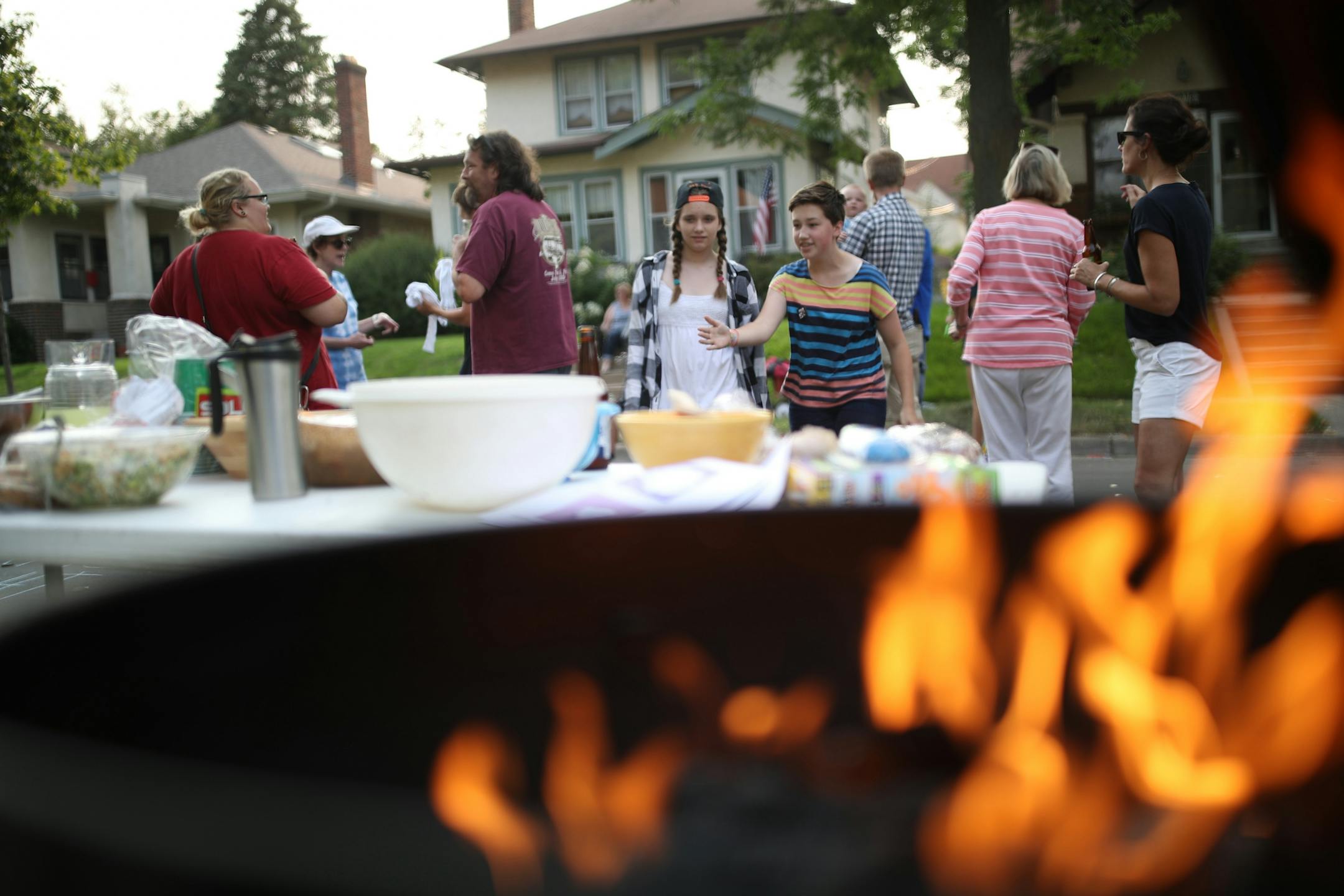 Neighbors gathered for a barbecue during National Night Out in the 4200 block of Harriet Avenue S. on Tuesday night in Minneapolis.