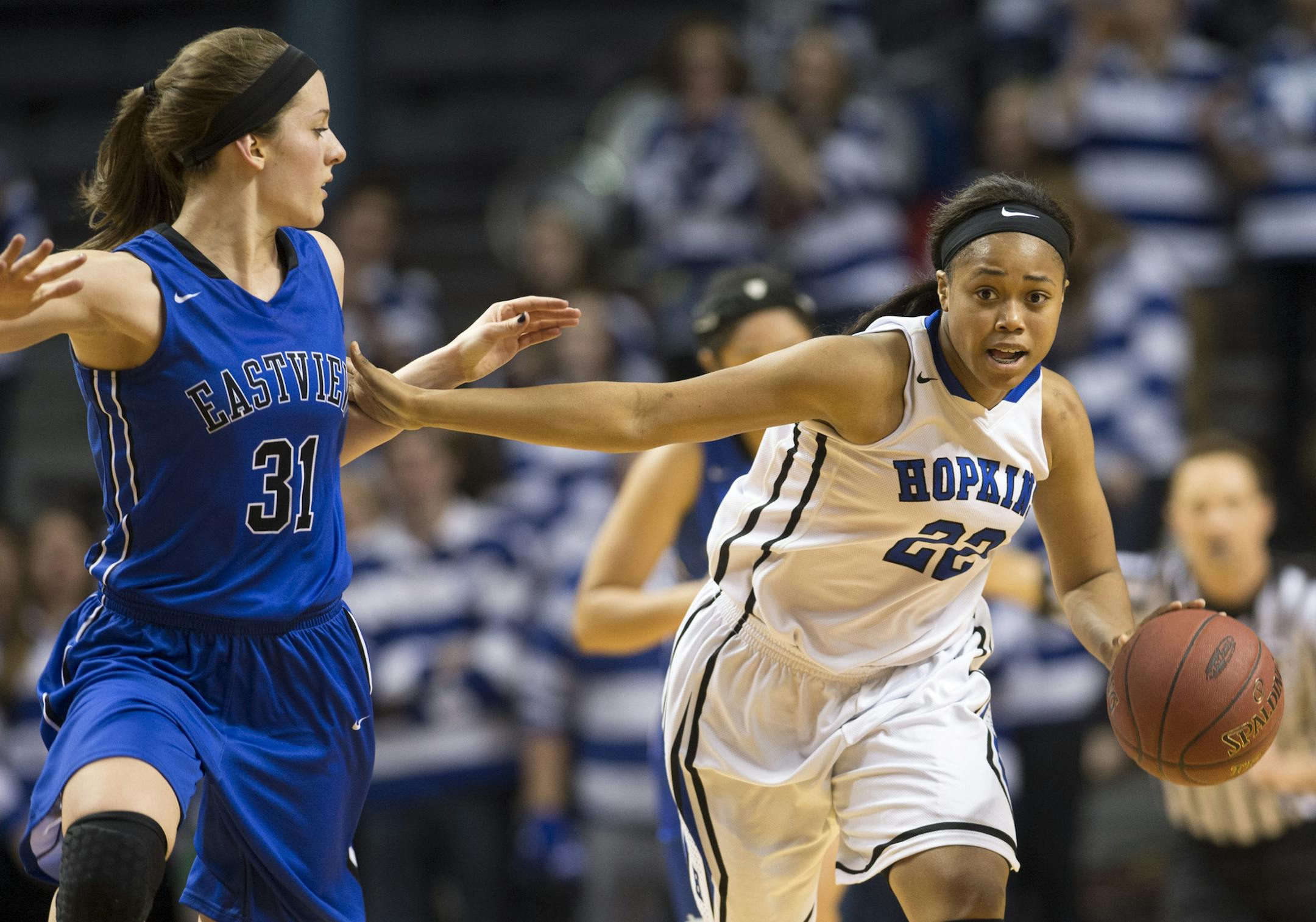 Hopkins guard TT Starks (22) moves the ball down the court while being defended by Eastview forward Hana Metoxen (31) in the first half. ] (Aaron Lavinsky | StarTribune) Eastview plays against Hopkins in the Class 4A girls' basketball championship game on Saturday, March 21, 2015 at Williams Arena. Eastview leads at half 30-28.