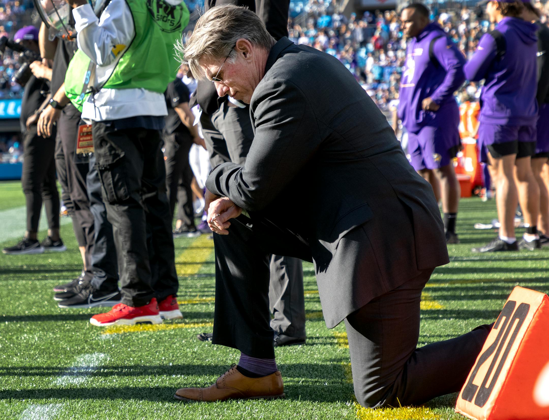 Minnesota Vikings general manager Rick Spielman took a knee as kicker Greg Joseph prepared to kick a potential game winning kick in the final second of the fourth quarter. Joseph missed and the game went into overtime.
