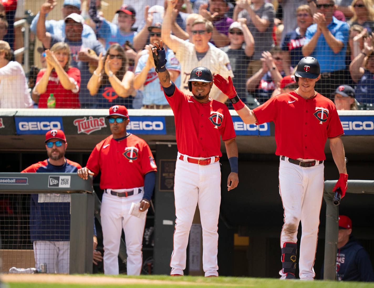 Minnesota Twins second baseman Luis Arraez (2) waves to teammate Byron Buxton who tripled in the second inning and hit him home Sunday afternoon, June 26, 2022 at Target Field in Minneapolis. The Minnesota Twins faced the Colorado Rockies in an interleague MLB baseball game. ] JEFF WHEELER • Jeff.Wheeler@startribune.com