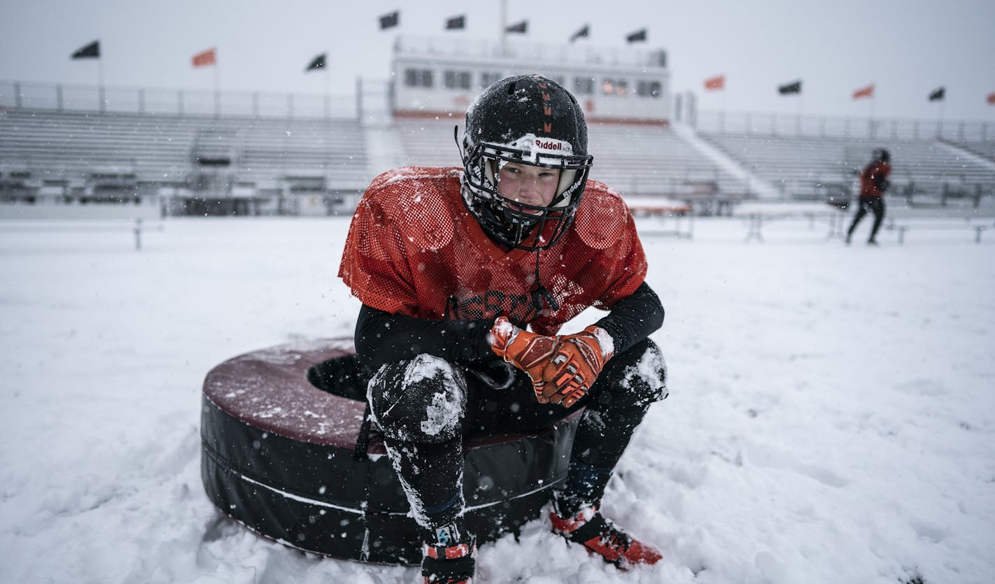 Osseo linebacker Michael Azure and teammates practiced outside in the heavy snow in preparation for their Friday night game against Totino-Grace.] Jerry Holt •Jerry.Holt@startribune.com Osseo football team practiced outside on the first measurable snowfall in the Twin Cities Tuesday ,October 20, 2020..