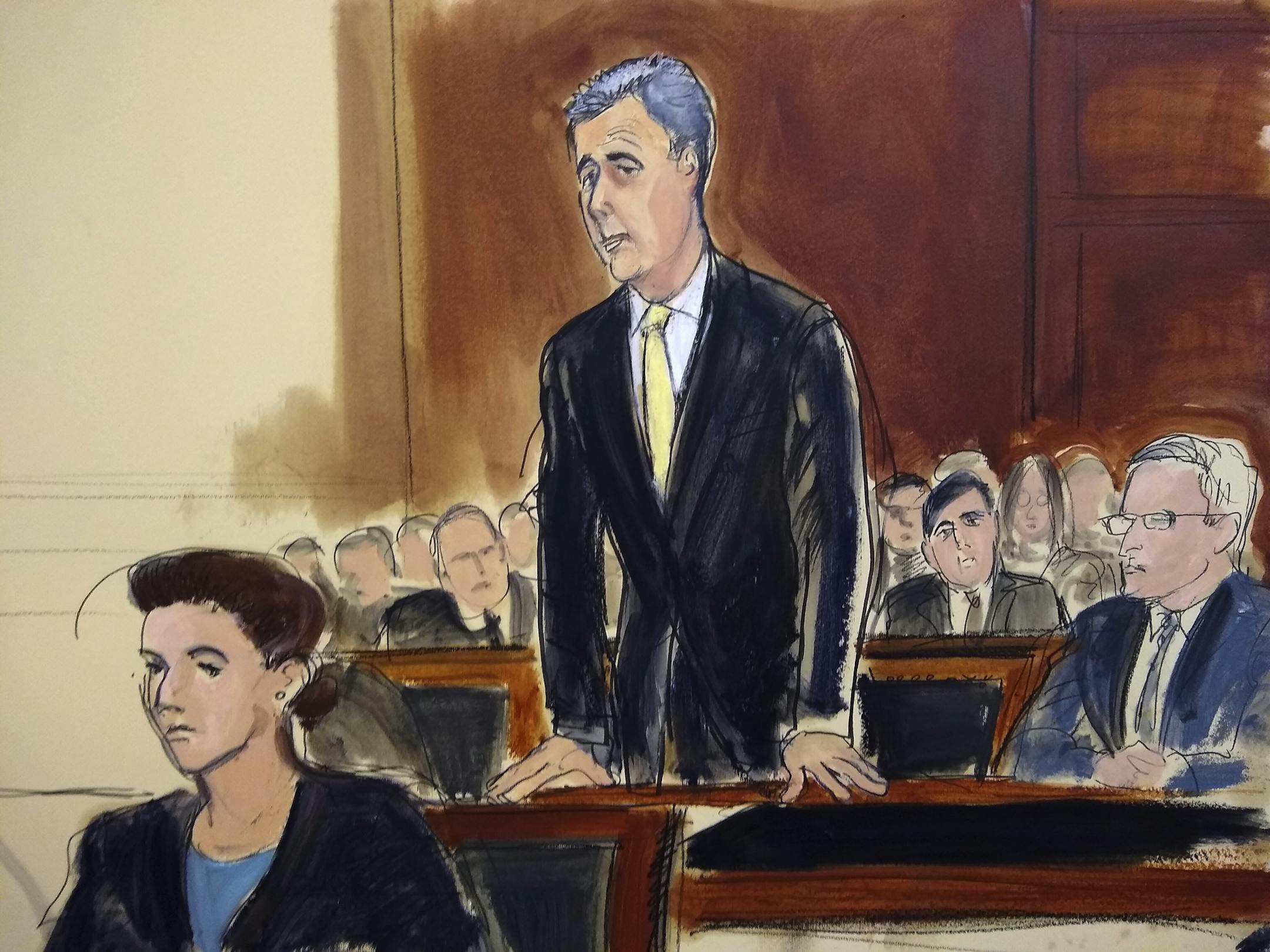 In this court room drawing, Michael Cohen stands to plead guilty, flanked by Assistant US Attorney Andrea Griswold, left, and Cohen's attorney Guy Petrillo, far right, at federal court in New York Tuesday, Aug. 21, 2018. Cohen, the personal lawyer and "fixer" who once said he would "take a bullet" for Donald Trump, struck a deal with prosecutors to plead guilty to charges including campaign finance fraud, bank fraud and tax evasion. Cohen stated that he and Trump arranged the payment of hush mon