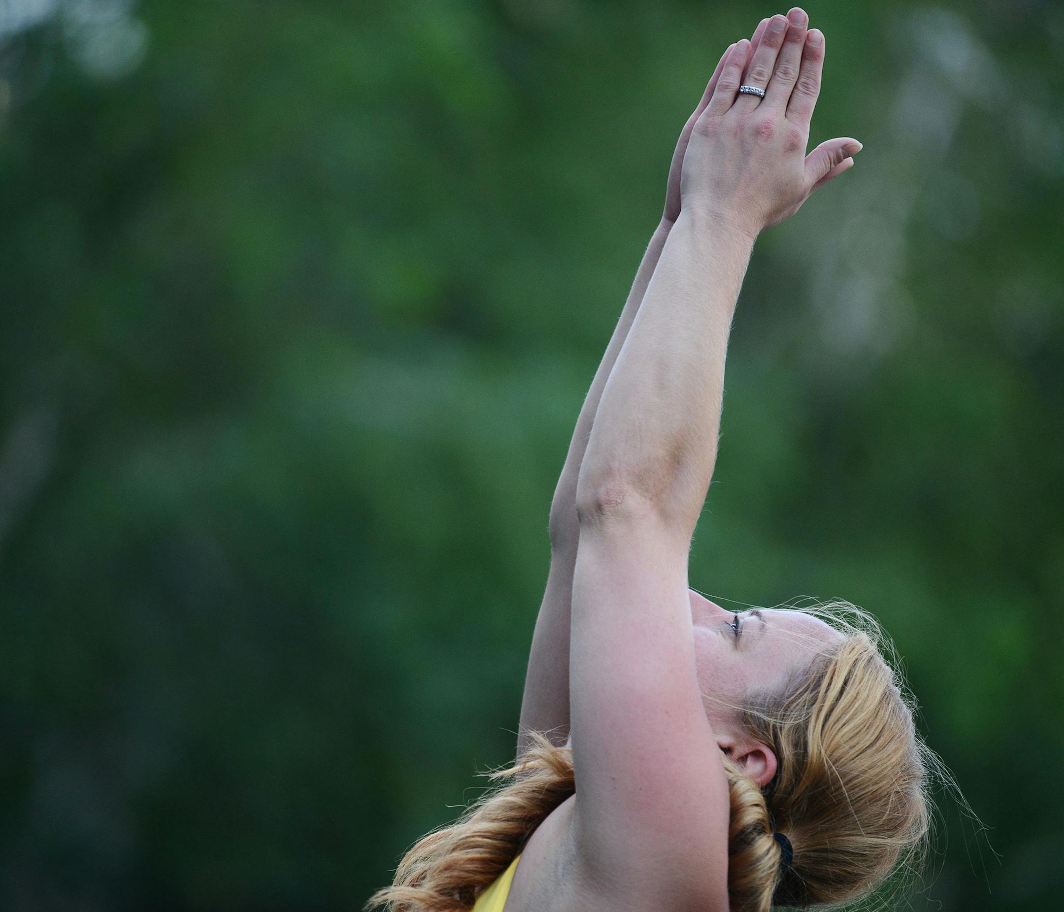 Annie Hanson, of Minneapolis, practiced yoga during Yoga Camp's free outdoor yoga event on International Yoga Day in Minneapolis, Minn., on Sunday June 21, 2015. Yoga Camp is new this year, and continues from the summer solstice to the autumn equinox. ] RACHEL WOOLF &#x2211; rachel.woolf@startribune.com