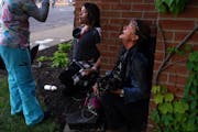 Los Angeles Times photojournalist Carolyn Cole, right, is shown after being tear gassed while covering unrest in Minneapolis in 2020 after George Floy