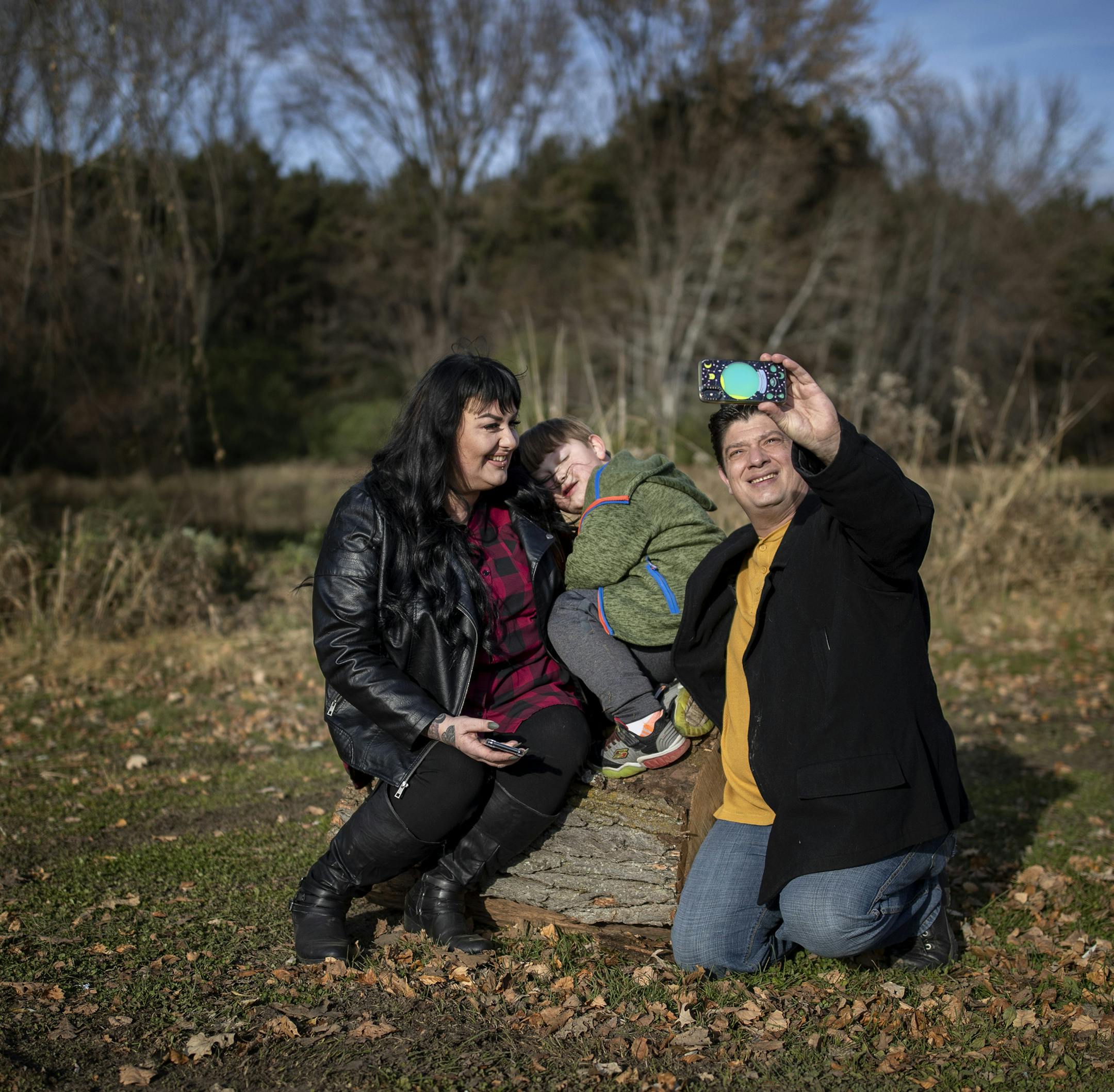 Rachel, Frankie, 5, and Tito Reyna took a selfie at Aamodt's Apple Farm in Stillwater. ] CARLOS GONZALEZ • cgonzalez@startribune.com – Stillwater, MN – November 3, 2019, Aamodt's Apple Farm, Tito Reyna, 48, a chef from Stillwater, has benefitted from a new mobile crisis program for East Metro residents who have been hospitalized for substance abuse. For the first time in decades, Reyna is confident about recovery and enjoying his work as a catering chef and his time at home
