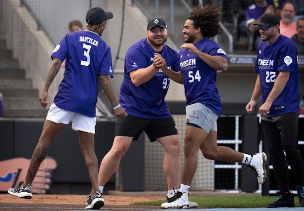 When the Vikings play softball, their long snapper becomes the star