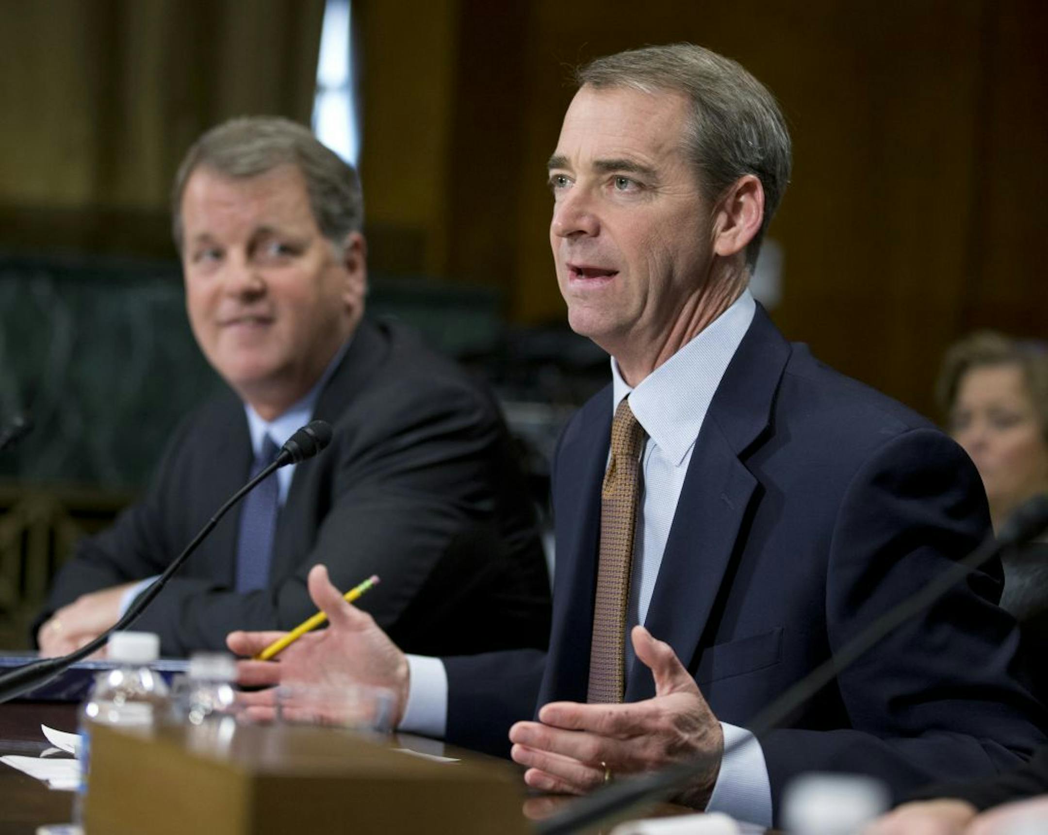 American Airlines and AMR Corporation, Chairman, President and CEO Thomas Horton, right, accompanied by US Airways Group Chairman and CEO Douglas Parker, testifies on Capitol Hill in Washington, Tuesday, March 19, 2013., before the Senate subcommittee on Antitrust, Competition Policy and Consumer Rights hearing on "The American Airlines/US Airways Merger: Consolidation, Competition, and Consumers".