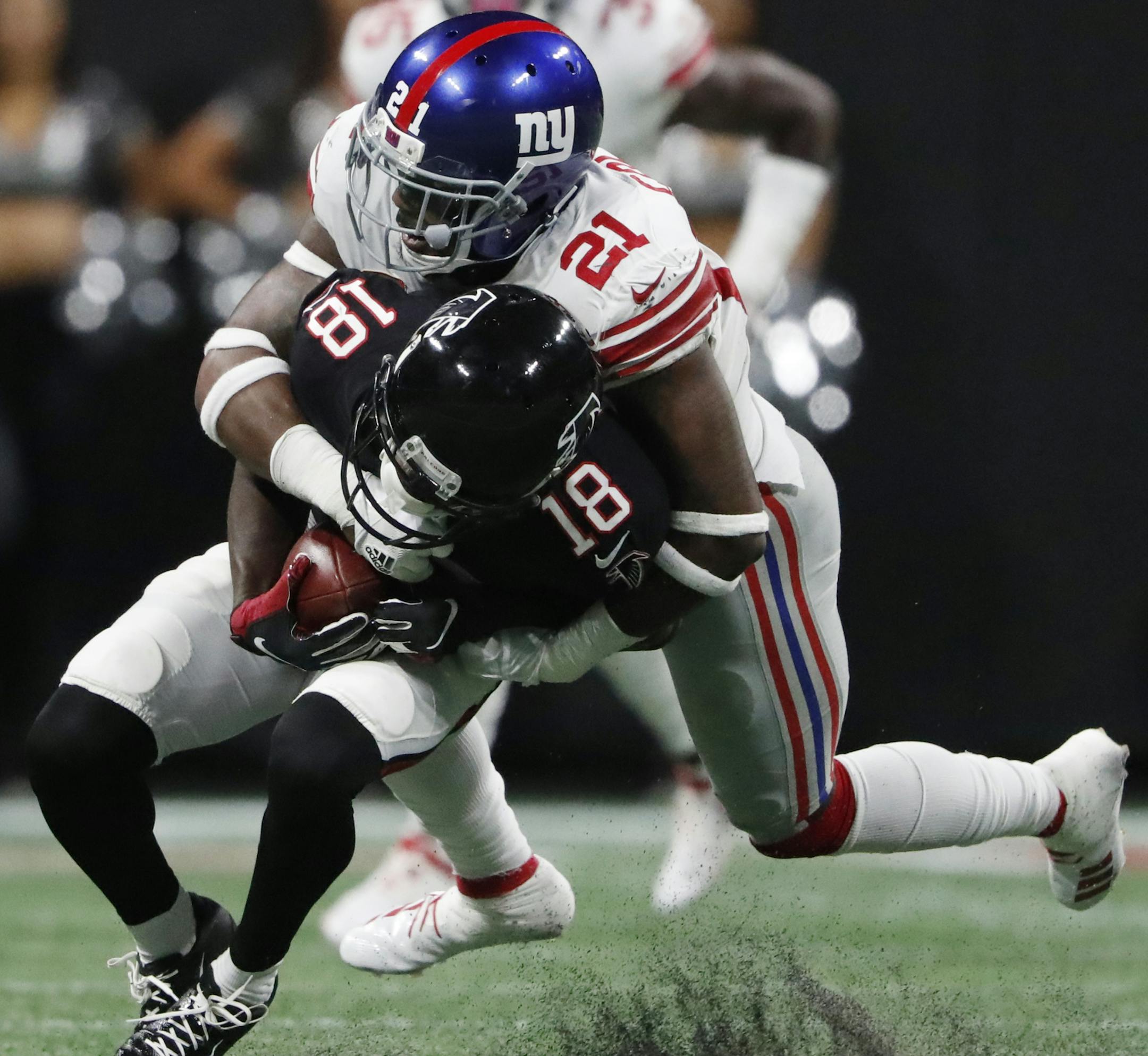 Atlanta Falcons wide receiver Calvin Ridley (18) is tackled by New York Giants strong safety Landon Collins (21) during the second half of an NFL football game, Monday, Oct. 22, 2018, in Atlanta. (AP Photo/John Bazemore)