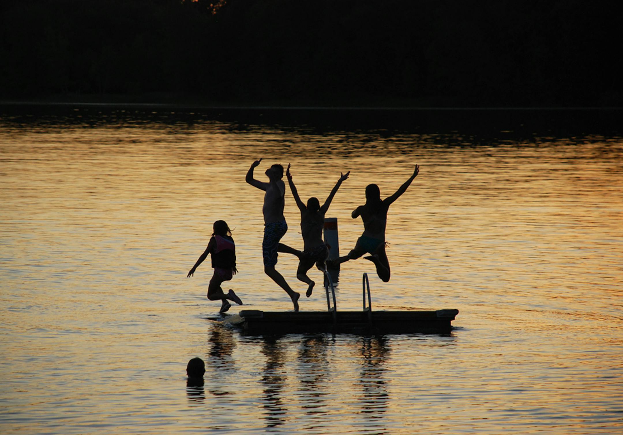 A dip at dusk, off the dock at Two Inlets Resort in Park Rapids. ] Photo by NANCY STRONG/Special to the Star Tribune