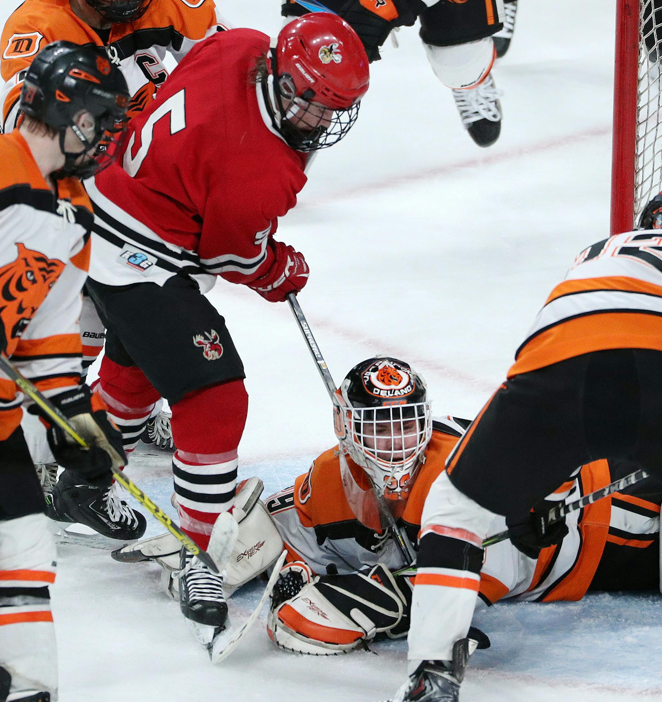 Delano goaltender Jackson Hjelle (29) went down a save on a shot from Monticello's Ben Ward (5) in the third period. ] ANTHONY SOUFFLE ï anthony.souffle@startribune.com Players competed during the boys' hockey state tournament Class 1A quarterfinals Wednesday, March 8, 2017 at the Xcel Energy Center in St. Paul, Minn.