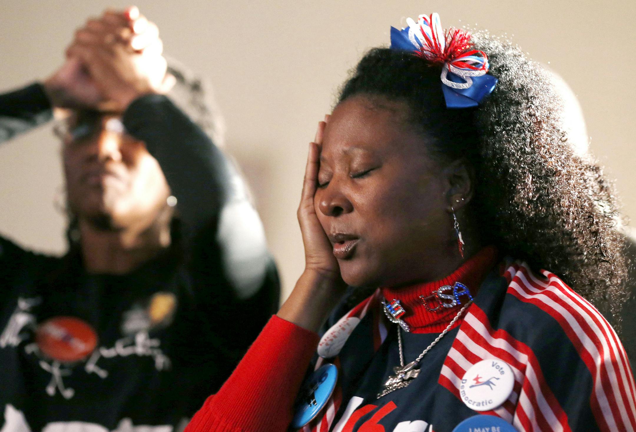 Allison Fenderson, right, and Lisa Wilder, left, watch as the returns come in during an election party hosted by the North Carolina Democratic Party at the Raleigh Marriott City Center in downtown Raleigh, N.C., on Tuesday, Nov. 8, 2016. (Ethan Hyman/Raleigh News & Observer/TNS) ORG XMIT: 1192870