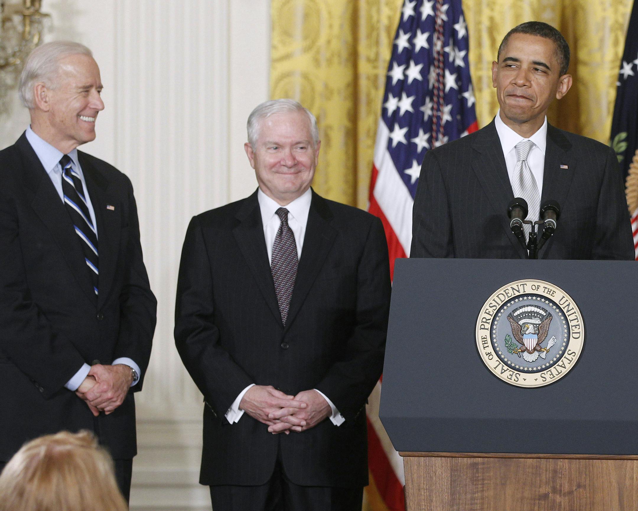 FILE - In this April 28. 2011 file photo, President Barack Obama stands in the East Room of the White House in Washington with, from left: Vice President Joe Biden and outgoing Defense Secretary Robert Gates. The White House is bristling over former Defense Secretary Robert Gates' new memoir accusing President Barack Obama of showing too little enthusiasm for the U.S. war mission in Afghanistan and sharply criticizing Vice President Joe Biden's foreign policy instincts. (AP Photo/Charles Dharapa